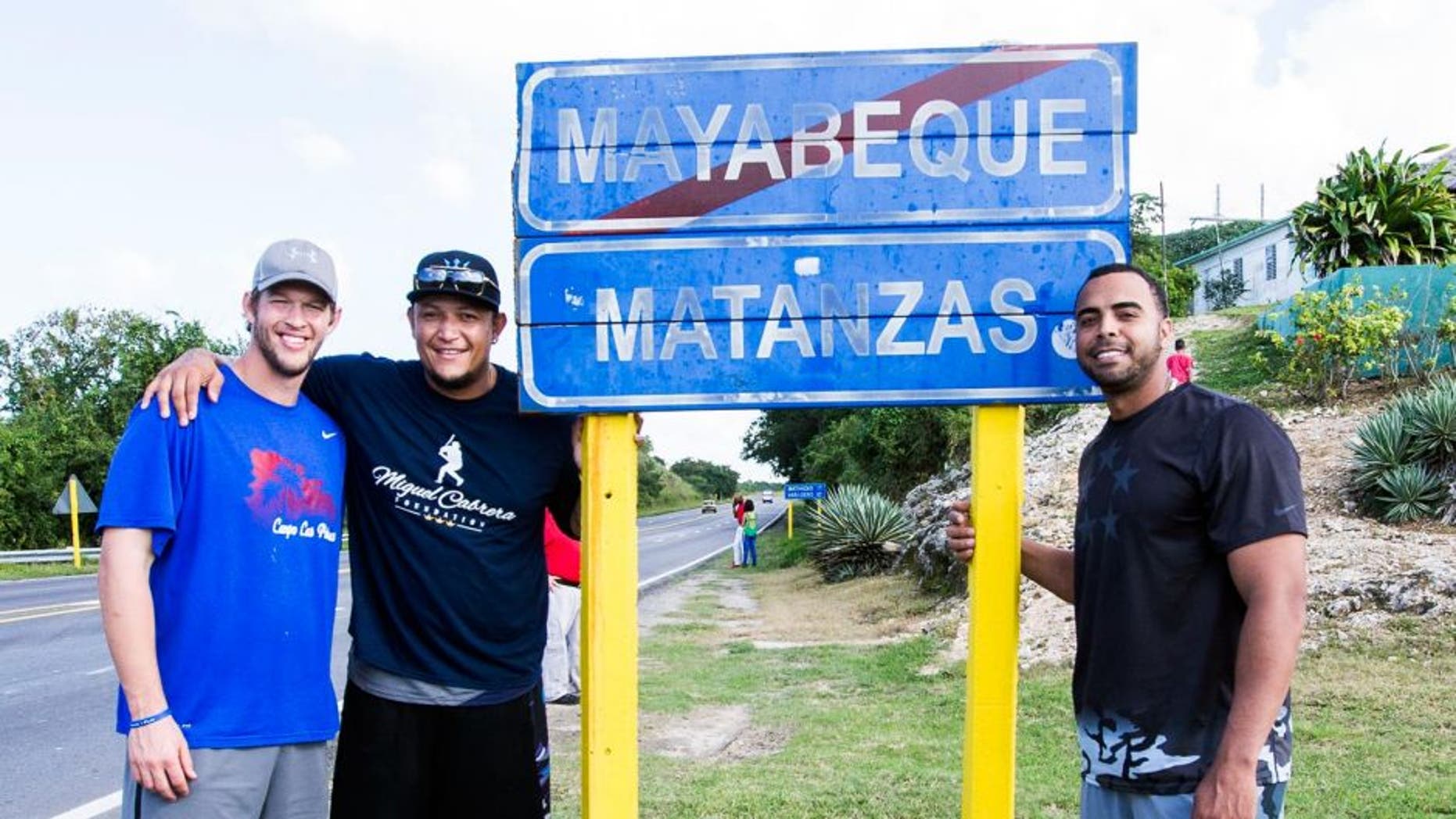 MATANZAS, CUBA - DECEMBER 17: Clayton Kershaw of the Los Angeles Dodgers, Miguel Cabrera of the Detroit Tigers, and Nelson Cruz of the Seattle Mariners pose for a photo on their way to a youth baseball clinic during an MLB goodwill tour on December 17, 2015 at Estadio Victoria de Giron in Matanzas, Cuba. (Photo by Rob Tringali/MLB Photos via Getty Images)