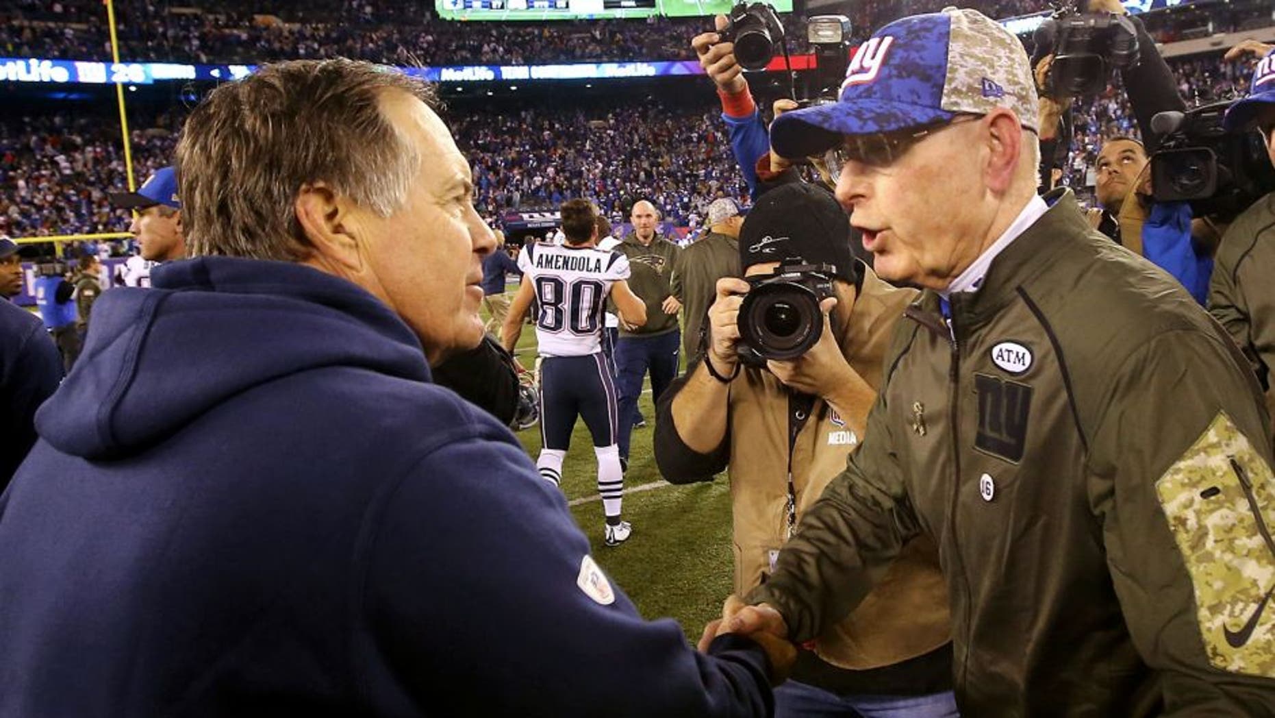 EAST RUTHERFORD, NJ - NOVEMBER 15: Head Coach Tom Coughlin of the New York Giants meets head coach Bill Belichick of the New England Patriots after the Patriots 27-26 win at MetLife Stadium on November 15, 2015 in East Rutherford, New Jersey. (Photo by Al Bello/Getty Images)