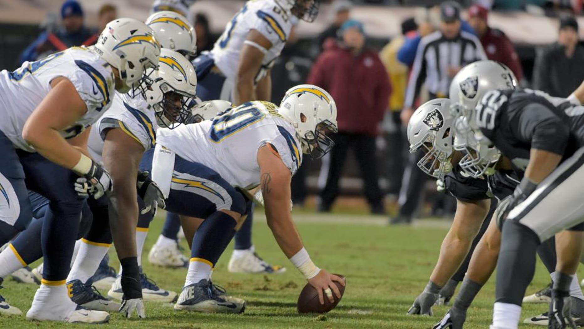 Dec 24, 2015; Oakland, CA, USA; General view of the line of scrimmage as San Diego Chargers center Trevor Robinson (60) prepares to snap the ball against the Oakland Raiders during an NFL football game at O.co Coliseum. The Raiders defeated the Chargers 23-20 in overtime. Mandatory Credit: Kirby Lee-USA TODAY Sports