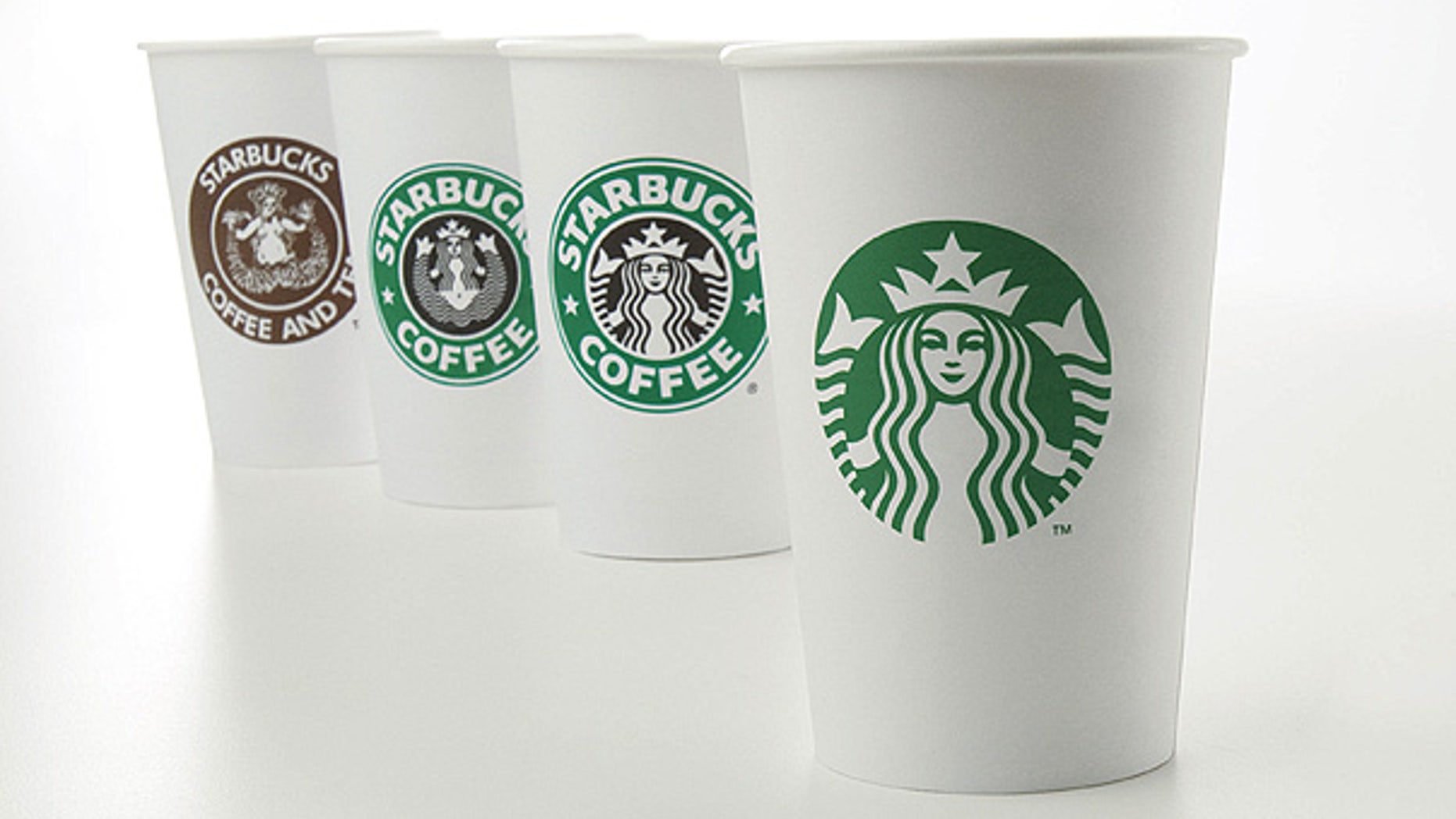 Starbucks' new 40-year anniversary logo is seen on a cup at right. The coffee giant is testing a new, super-expensive Costa Rica Finca Palmilera brew that sells for $7 a pop.