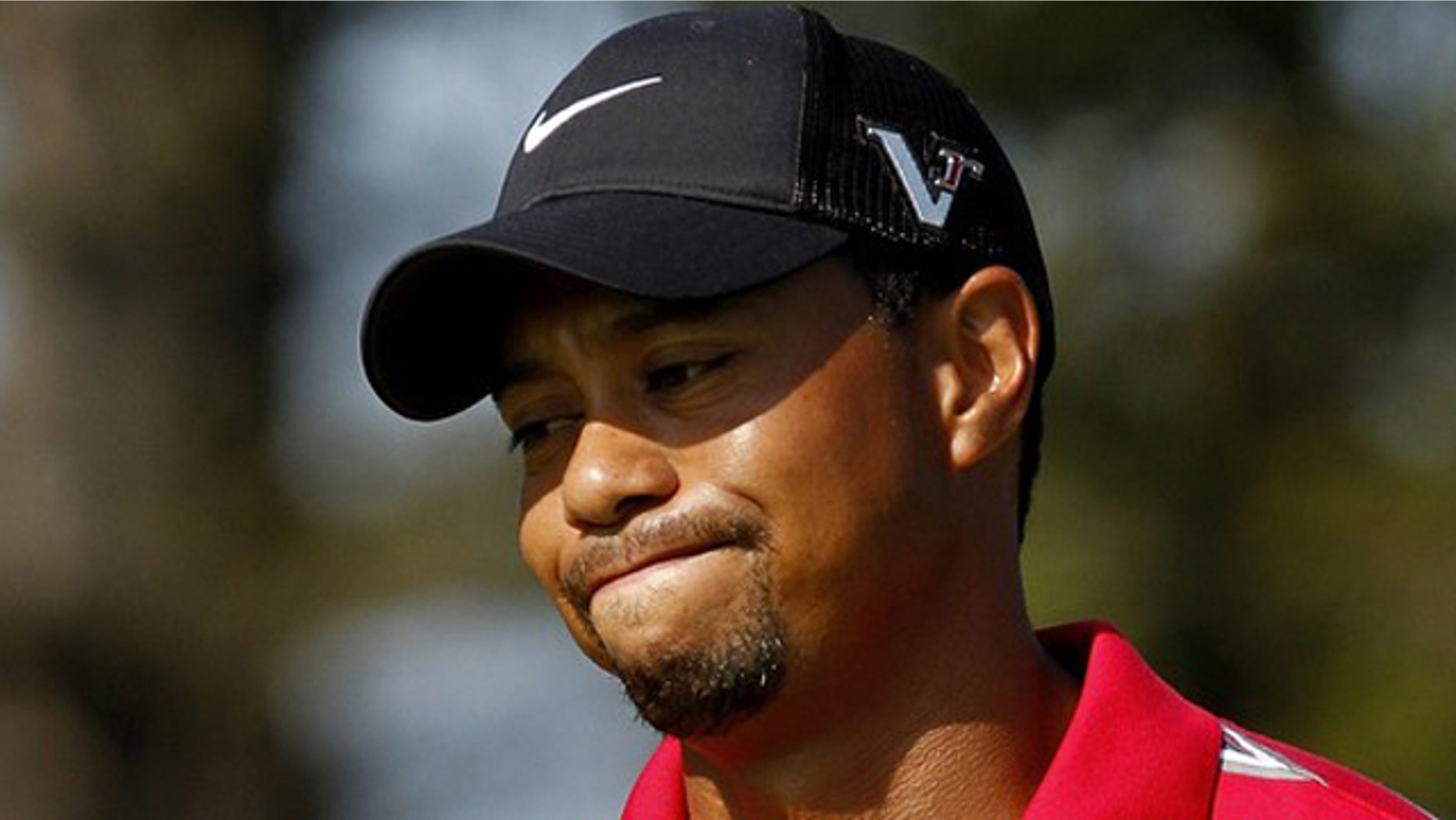 Aug. 8: Tiger Woods reacts after missing a putt during the WGC Bridgestone Invitational golf tournament in Akron, Ohio.