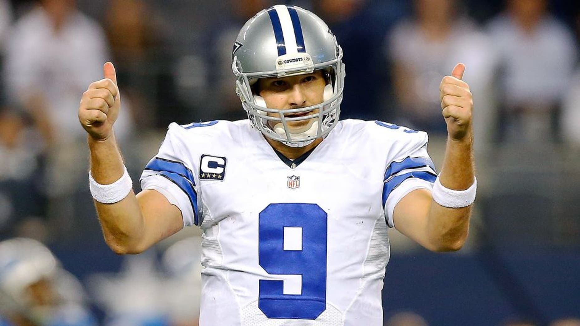 ARLINGTON, TX - JANUARY 04: Tony Romo #9 of the Dallas Cowboys gestures against the Detroit Lions during the second half of their NFC Wild Card Playoff game at AT&T Stadium on January 4, 2015 in Arlington, Texas. (Photo by Tom Pennington/Getty Images)