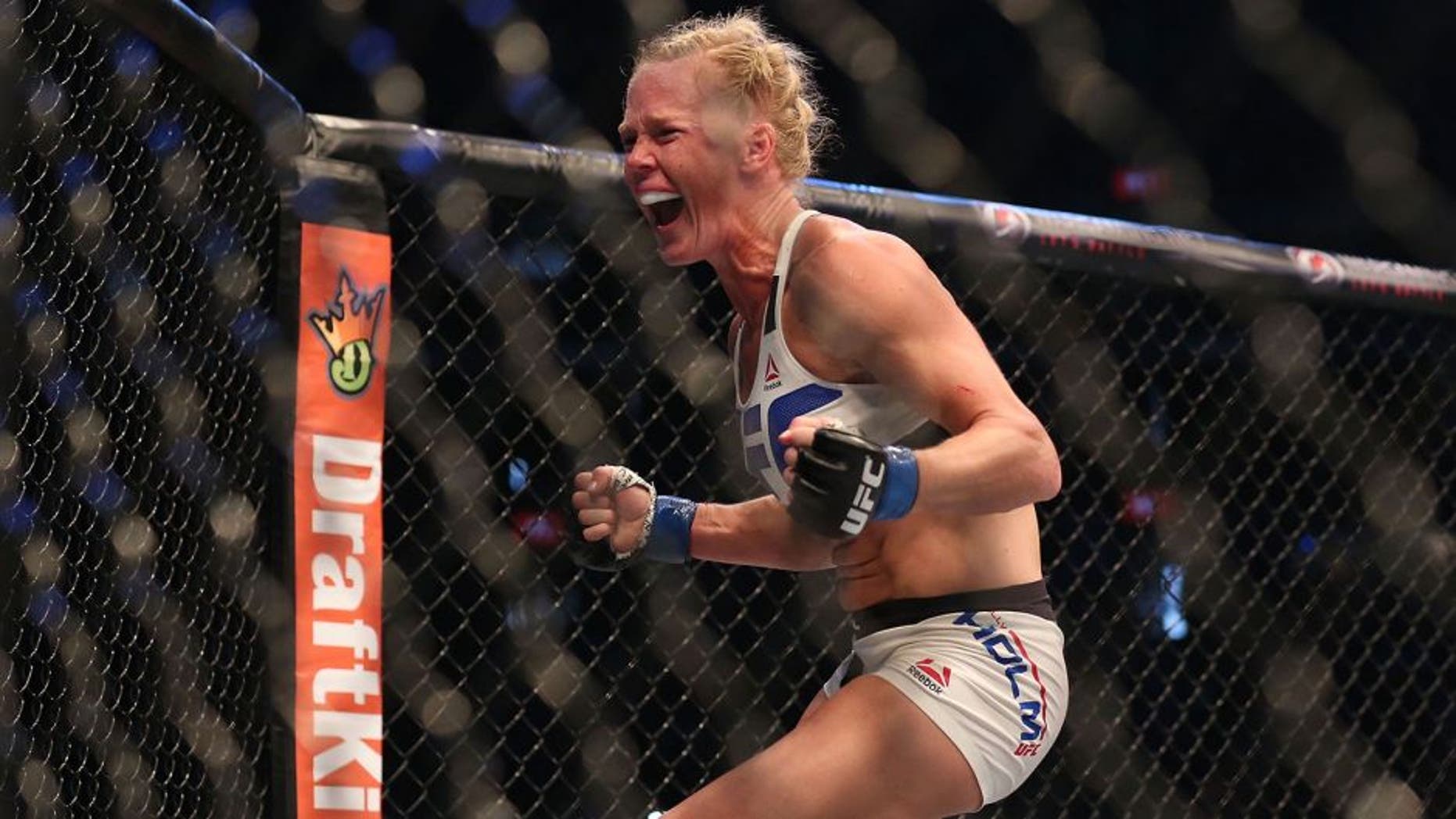 MELBOURNE, AUSTRALIA - NOVEMBER 15: Holly Holm of the United States celebrates victory over Ronda Rousey of the United States in their UFC women's bantamweight championship bout during the UFC 193 event at Etihad Stadium on November 15, 2015 in Melbourne, Australia. (Photo by Quinn Rooney/Getty Images)