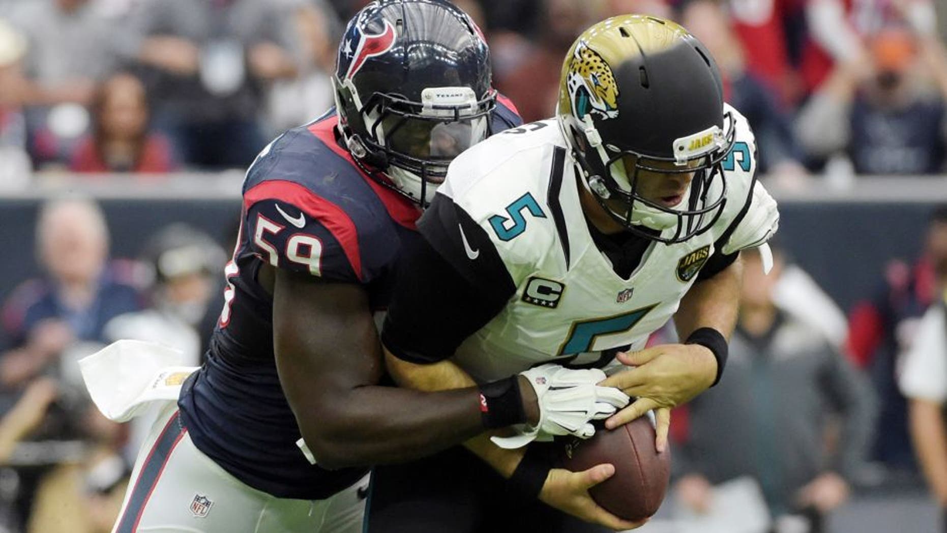 Jan 3, 2016; Houston, TX, USA; Houston Texans outside linebacker Whitney Mercilus (59) sacks Jacksonville Jaguars quarterback Blake Bortles (5) during an NFL football game at NRG Stadium. Mandatory Credit: Kirby Lee-USA TODAY Sports