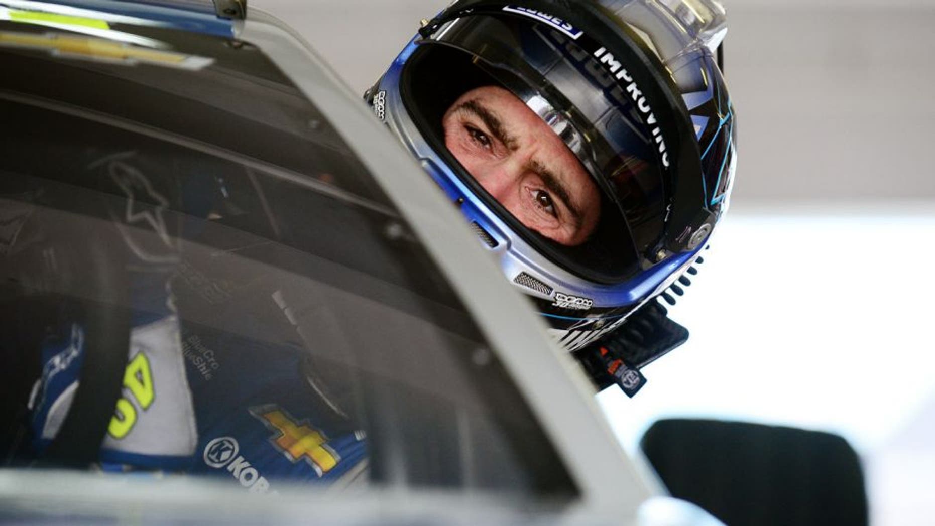 HOMESTEAD, FL - NOVEMBER 20: Jimmie Johnson, driver of the #48 Lowe's Chevrolet, climbs into his car during practice for the NASCAR Sprint Cup Series Ford EcoBoost 400 at Homestead-Miami Speedway on November 20, 2015 in Homestead, Florida. (Photo by Jeff Curry/Getty Images)