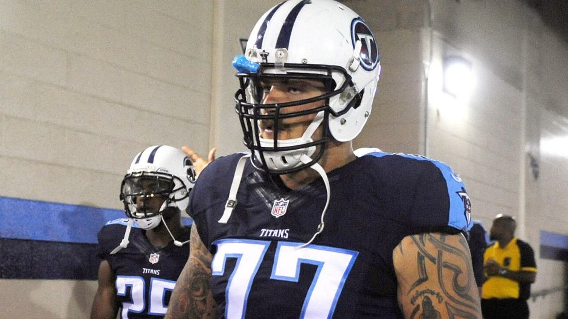 Sep 3, 2015; Nashville, TN, USA; Tennessee Titans offensive tackle Taylor Lewan (77) prior to the game against the Minnesota Vikings at Nissan Stadium. Mandatory Credit: Christopher Hanewinckel-USA TODAY Sports