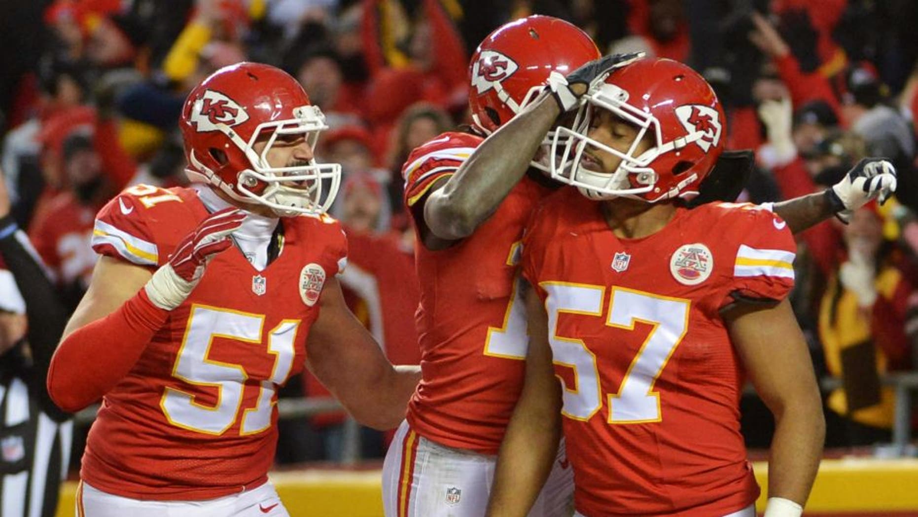 Jan 3, 2016; Kansas City, MO, USA; Kansas City Chiefs linebacker D.J. Alexander (57) is congratulated after blocking a punt during the second half against the Oakland Raiders at Arrowhead Stadium. The Chiefs won 23-17. Mandatory Credit: Denny Medley-USA TODAY Sports