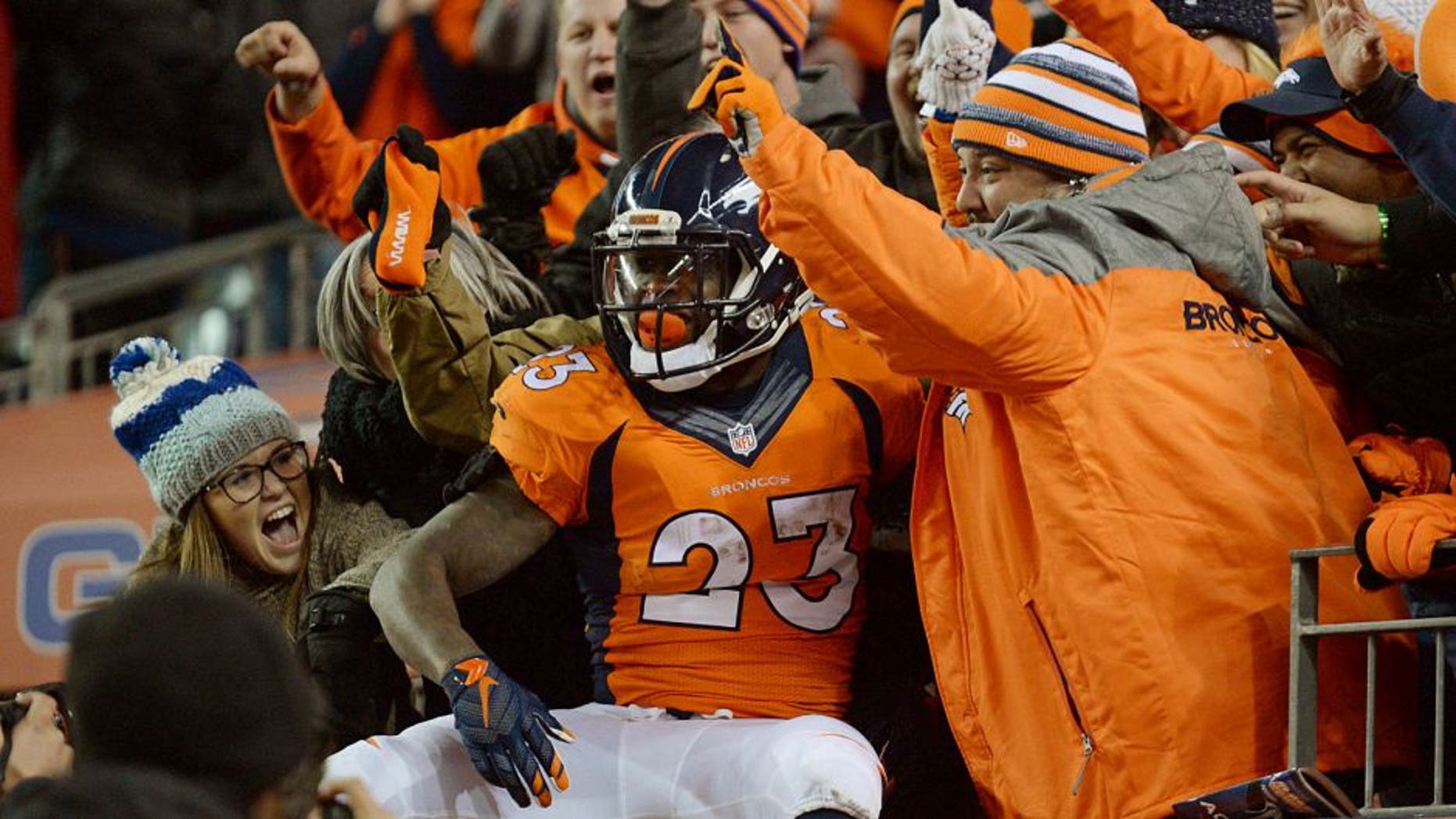 Jan 3, 2016; Denver, CO, USA; Denver Broncos running back Ronnie Hillman (23) celebrates scoring a touchdown in the fourth quarter against the San Diego Chargers at Sports Authority Field at Mile High. The Broncos defeated the Chargers 27-20. Mandatory Credit: Ron Chenoy-USA TODAY Sports
