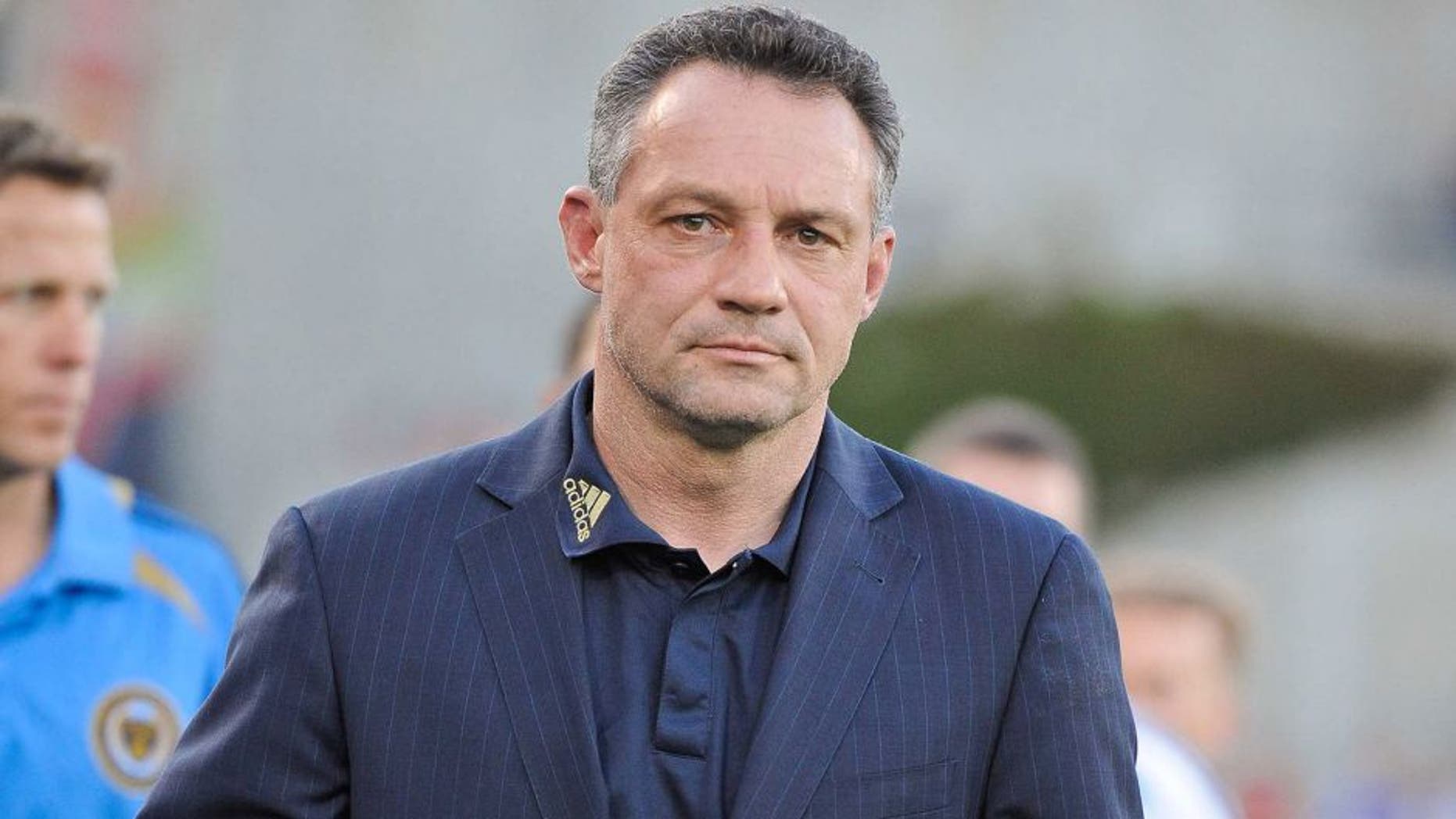 May 19, 2012; Frisco, TX, USA; Philadelphia Union head coach Piotr Nowak leads his team on the field to face the FC Dallas at FC Dallas Stadium. FC Dallas and Philadelphia Union ended tied 1-1. Mandatory Credit: Jerome Miron-USA TODAY Sports