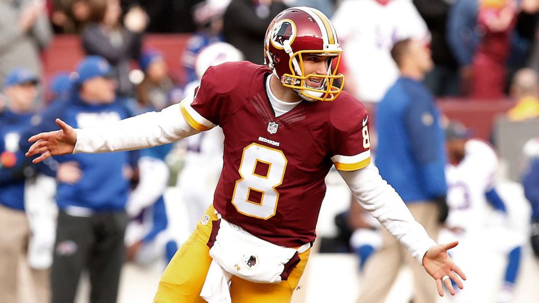 Dec 20, 2015; Landover, MD, USA; Washington Redskins quarterback Kirk Cousins (8) celebrates after throwing a touchdown pass to Redskins wide receiver DeSean Jackson (not pictured) against the Buffalo Bills in the third quarter at FedEx Field. The Redskins won 35-25. Mandatory Credit: Geoff Burke-USA TODAY Sports