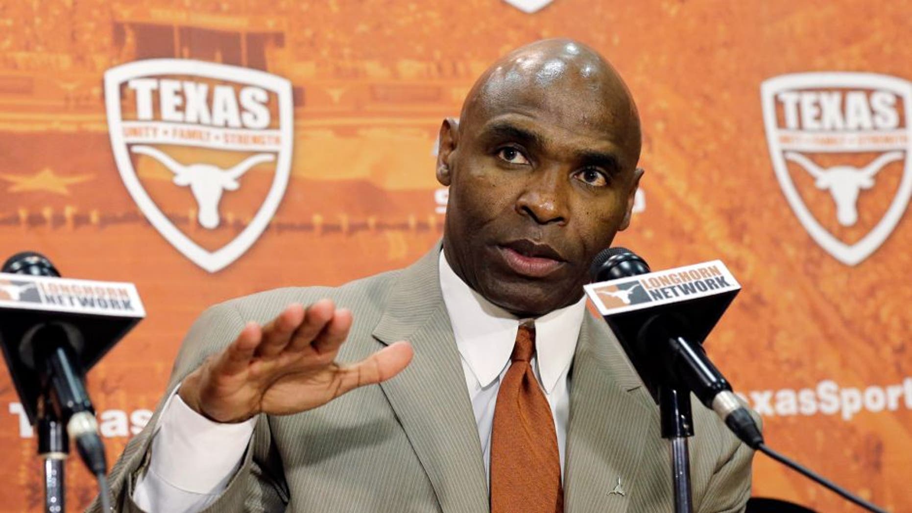 Charlie Strong answers questions during an NCAA college football news conference where Strong was introduced as the new Texas football coach, Monday, Jan. 6, 2014, in Austin, Texas. Strong replaces Mack Brown, who coached Texas for 16 years and won the 2005 national championship.