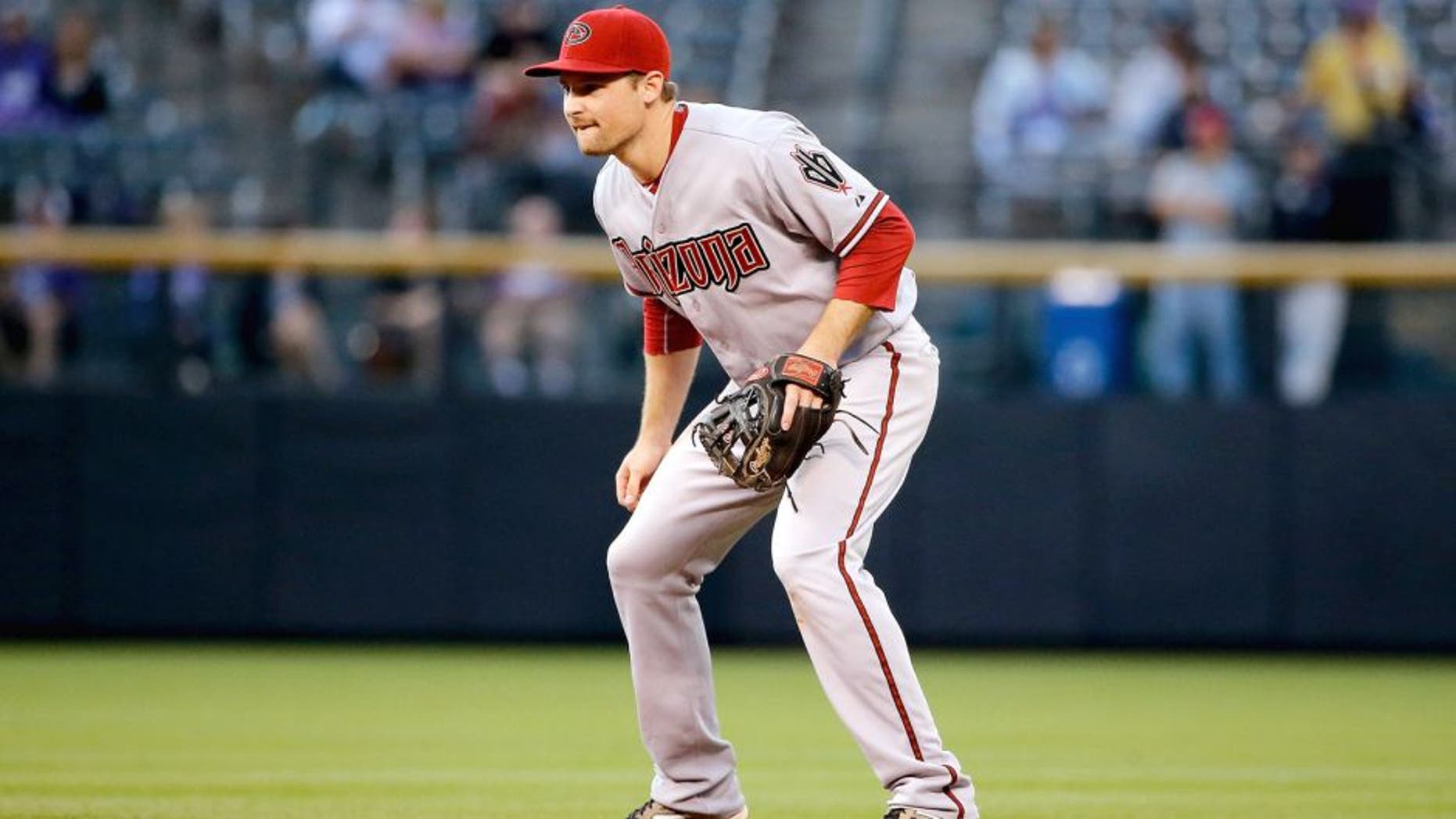 DENVER, CO - AUGUST 31: Second baseman Phil Gosselin #15 of the Arizona Diamondbacks plays defense against the Colorado Rockies at Coors Field on August 31, 2015 in Denver, Colorado. The Rockies defeated the Diamondbacks 5-4. (Photo by Doug Pensinger/Getty Images)