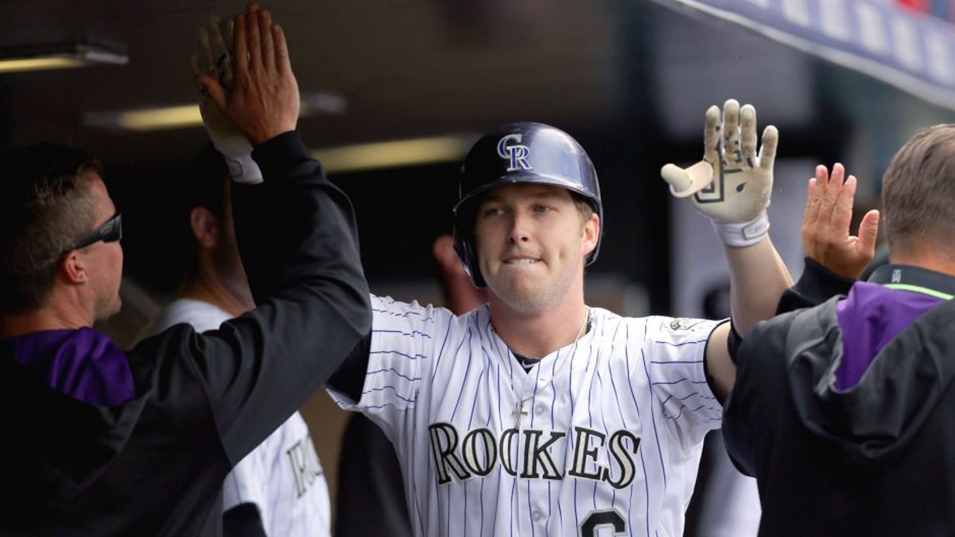 DENVER, CO - APRIL 23: Corey Dickerson #6 of the Colorado Rockies celebrates his solo home run during the fifth inning against the San Diego Padres at Coors Field on April 23, 2015 in Denver, Colorado. The Rockies defeated the Padres 2-1. (Photo by Justin Edmonds/Getty Images)