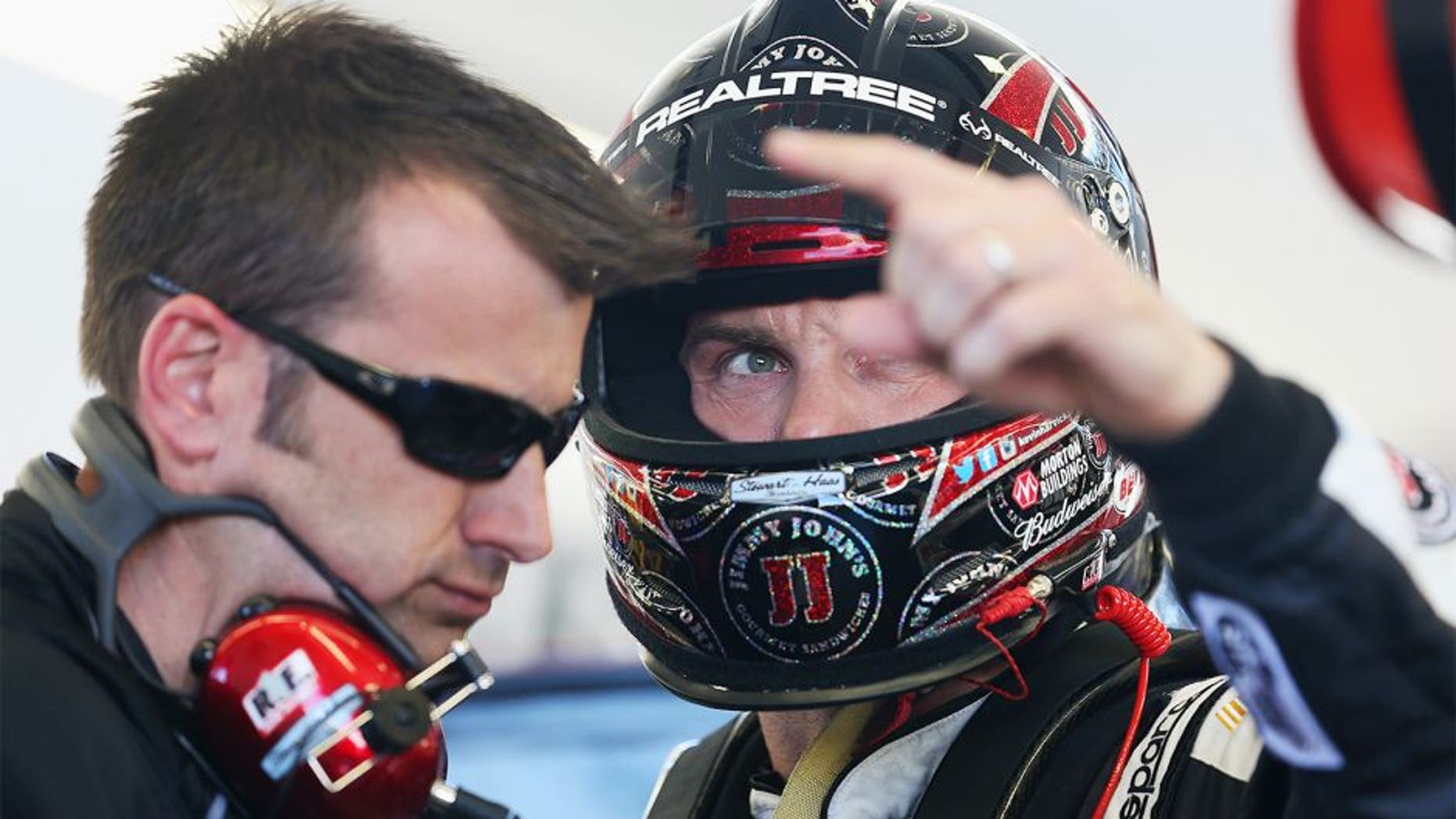 LAS VEGAS, NV - MARCH 07: Kevin Harvick (right), driver of the #4 Jimmy John's Chevrolet, speaks with his crew chief Rodney Childers during practice for the NASCAR Sprint Cup Series Kobalt 400 at Las Vegas Motor Speedway on March 7, 2014 in Las Vegas, Nevada. (Photo by Nick Laham/Getty Images)