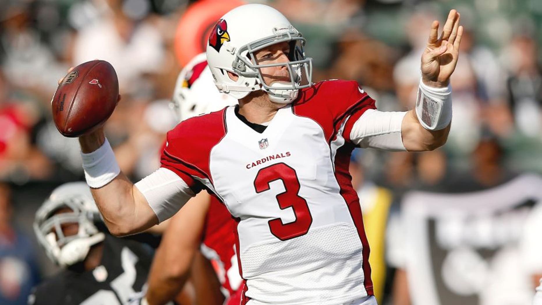 OAKLAND, CA - AUGUST 30: Carson Palmer #3 of the Arizona Cardinals throws the ball against the Oakland Raiders at O.co Coliseum on August 30, 2015 in Oakland, California. (Photo by Ezra Shaw/Getty Images)
