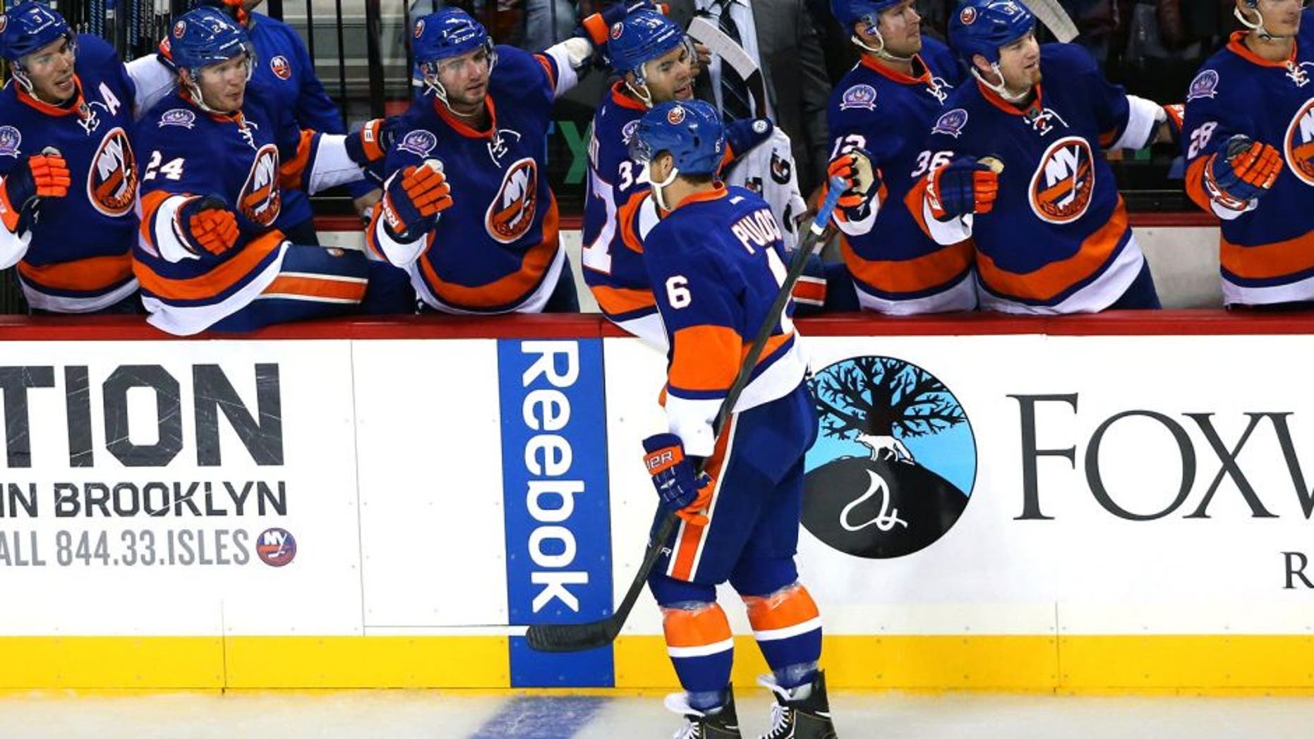 Sep 26, 2014; Brooklyn, NY, USA; New York Islanders defenseman Ryan Pulock (6) high fives the bench after scoring during the first period against the New Jersey Devils at Barclays Center. Mandatory Credit: Anthony Gruppuso-USA TODAY Sports