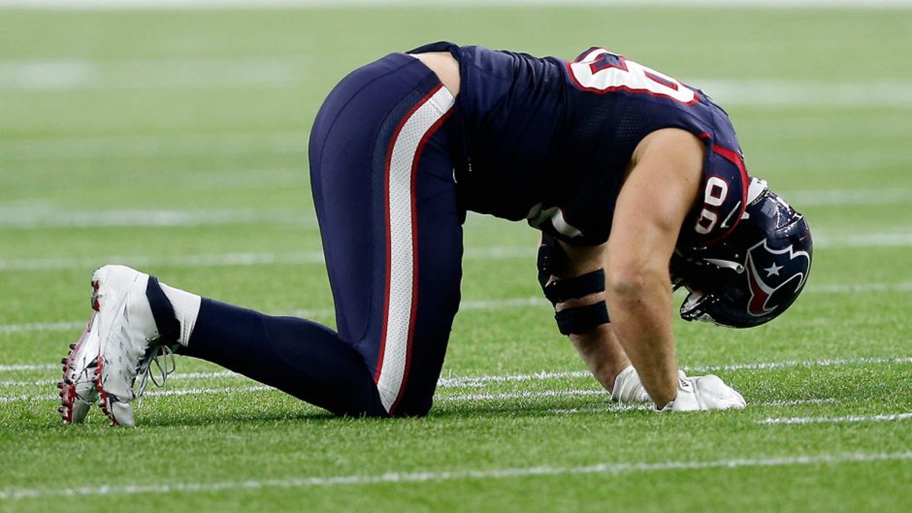 HOUSTON, TX - JANUARY 09: J.J. Watt #99 of the Houston Texans reacts in the second half against the Kansas City Chiefs during the AFC Wild Card Playoff game at NRG Stadium on January 9, 2016 in Houston, Texas. The Chiefs won 30-0 against the Texans. (Photo by Bob Levey/Getty Images)