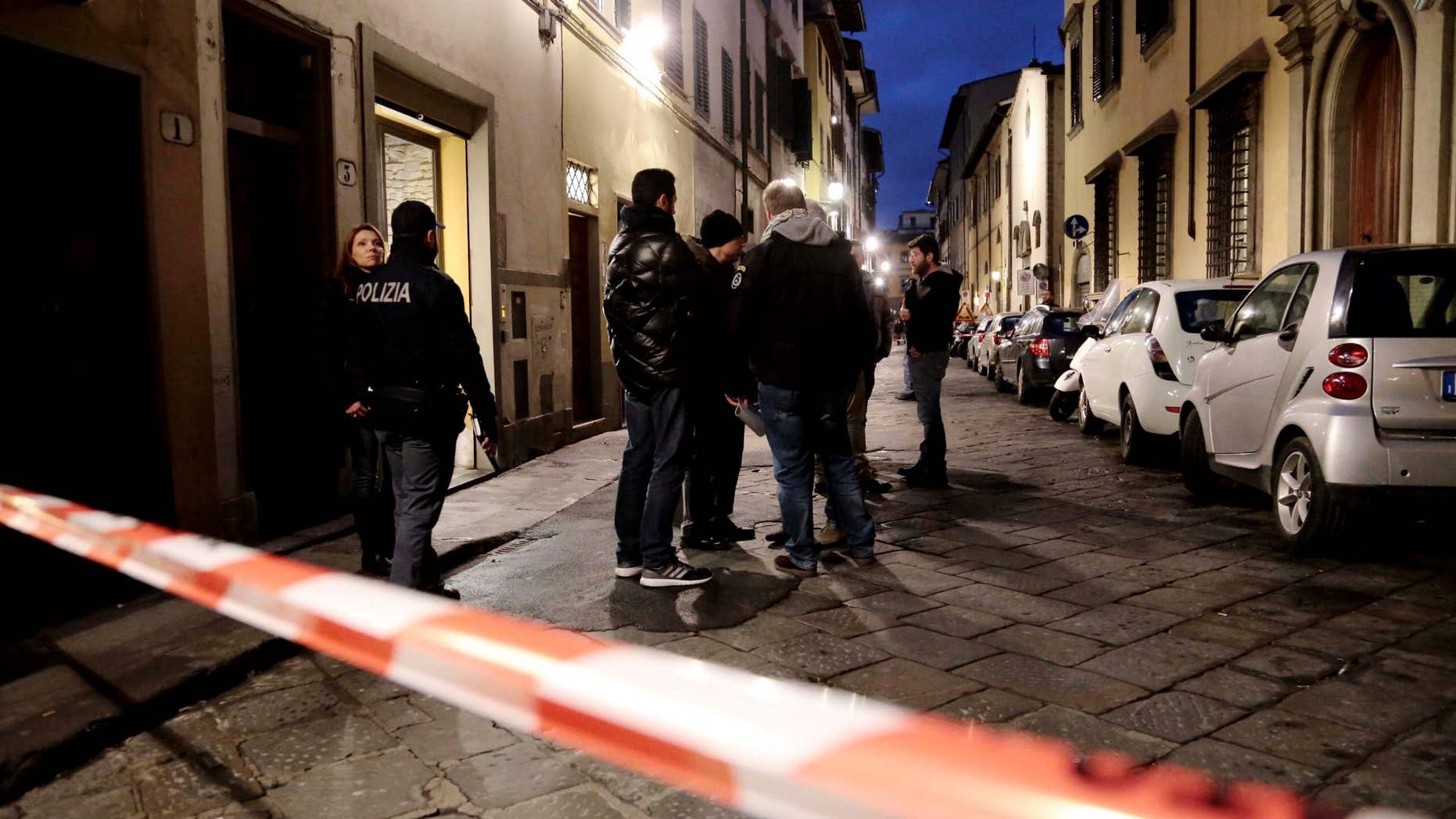 Jan. 9, 2016: Italian police officers stand outside an apartment where 35-year-old American woman Ashley Oslen was found dead, in Florence, Italy