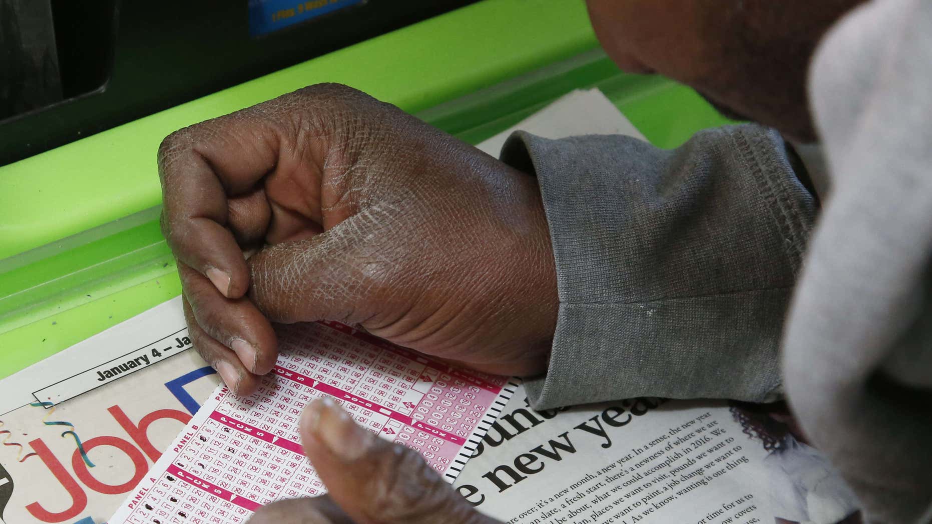 Jan. 5, 2016: Jermaine Emory Mallory fills out a Powerball number selection slip at a store in Oklahoma City/