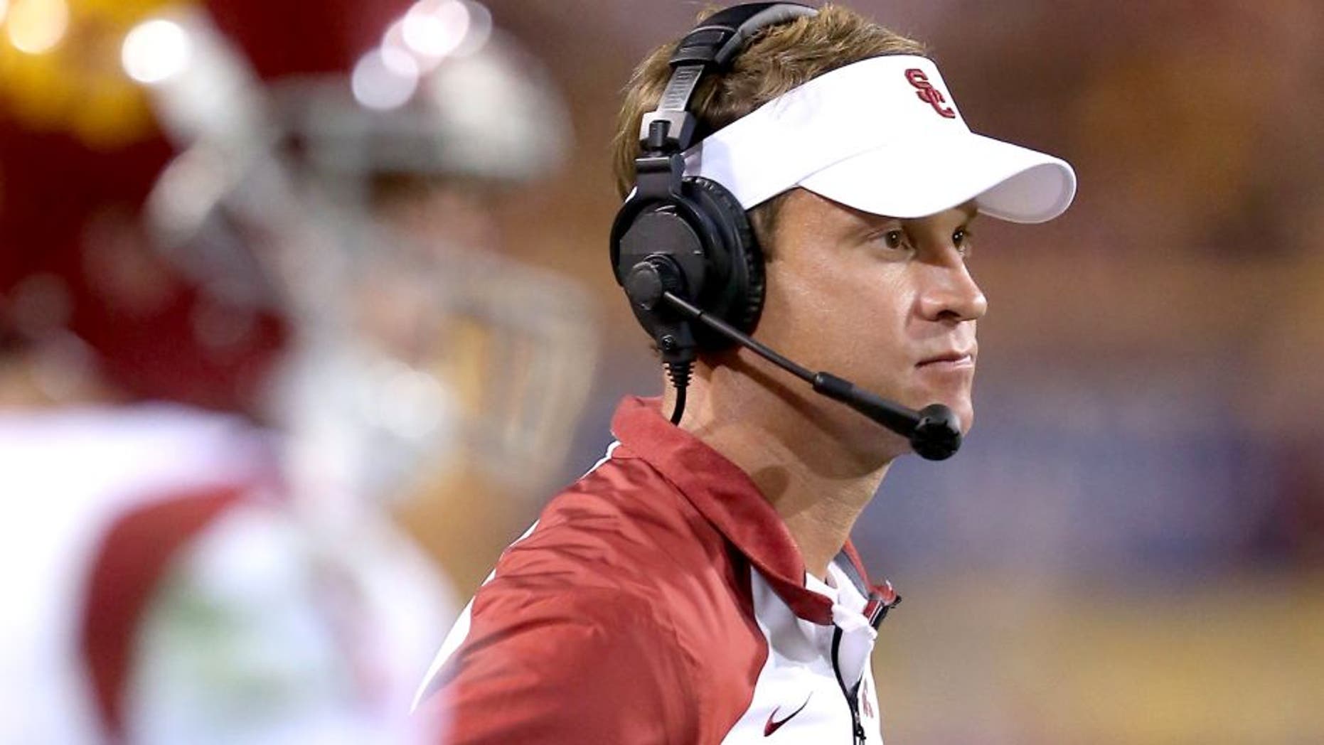 TEMPE, AZ - SEPTEMBER 28: Head coach Lane Kiffin of the USC Trojans looks on during the college football game against the Arizona State Sun Devils at Sun Devil Stadium on September 28, 2013 in Tempe, Arizona. The Sun Devils defeated the Trojans 62-41. (Photo by Christian Petersen/Getty Images) *** Local Caption *** Lane Kiffin