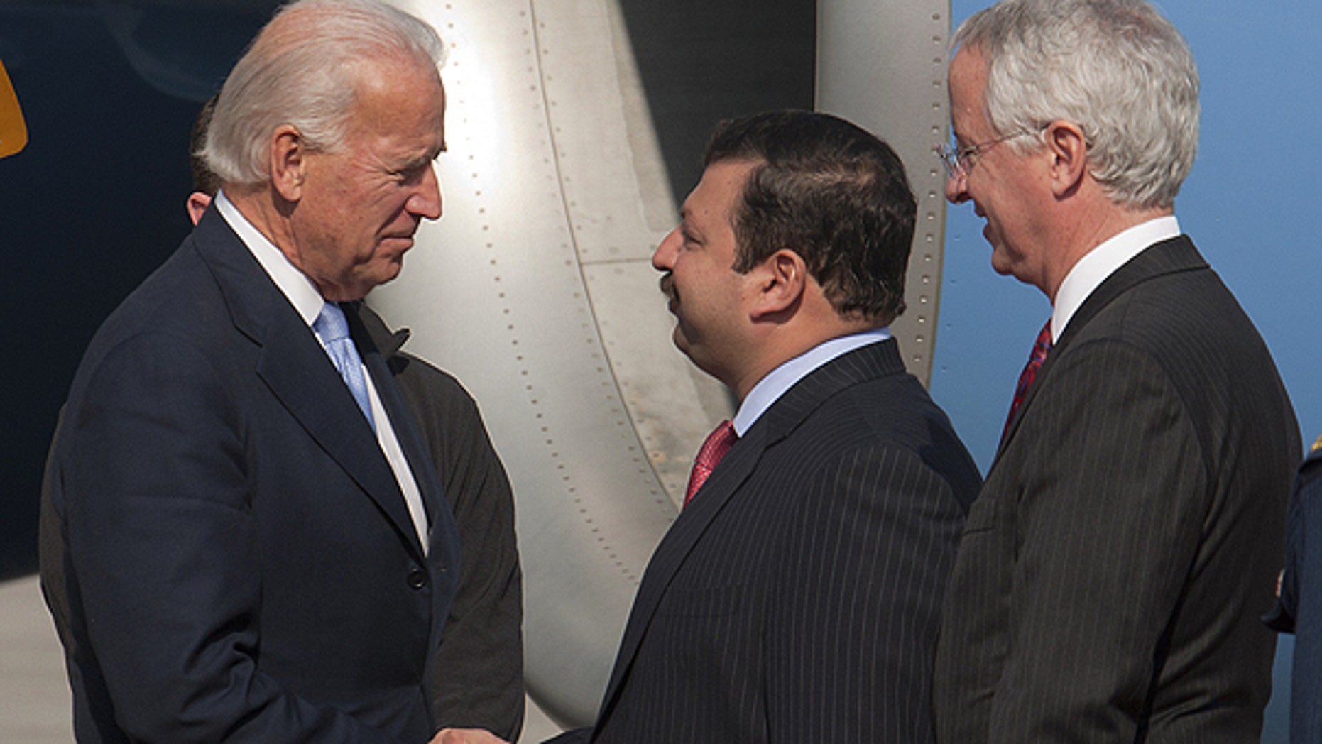 Jan. 12: U.S. Vice President Joe Biden, left, is welcomed by Pakistani Minister of State for Foreign Affairs Nawabzada Malik Amad Khan and U.S. Ambassador to Pakistan Cameron Munter, right, upon his arrival at airforce base in Rawalpidi, Pakistan.