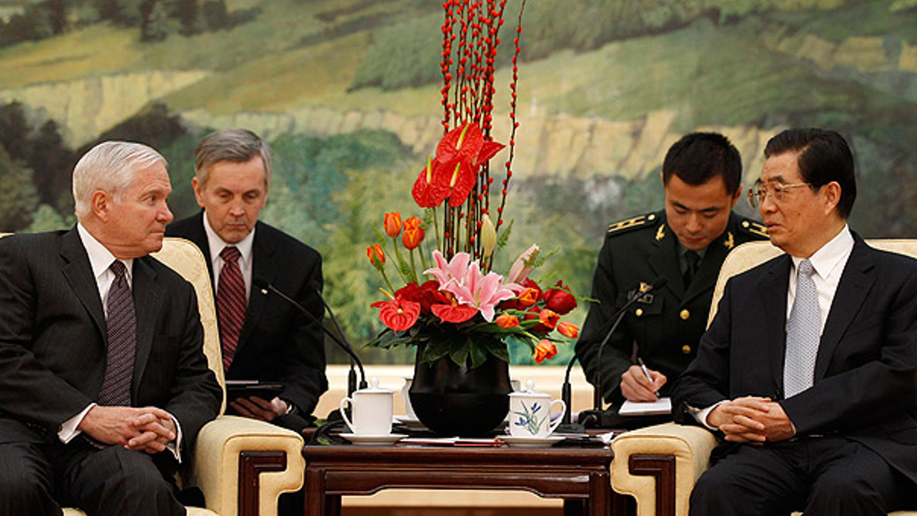 Jan. 11: Secretary of Defense Robert Gates, left, listens to Chinese President Hu Jintao during a meeting at the Great Hall of the People in Beijing.