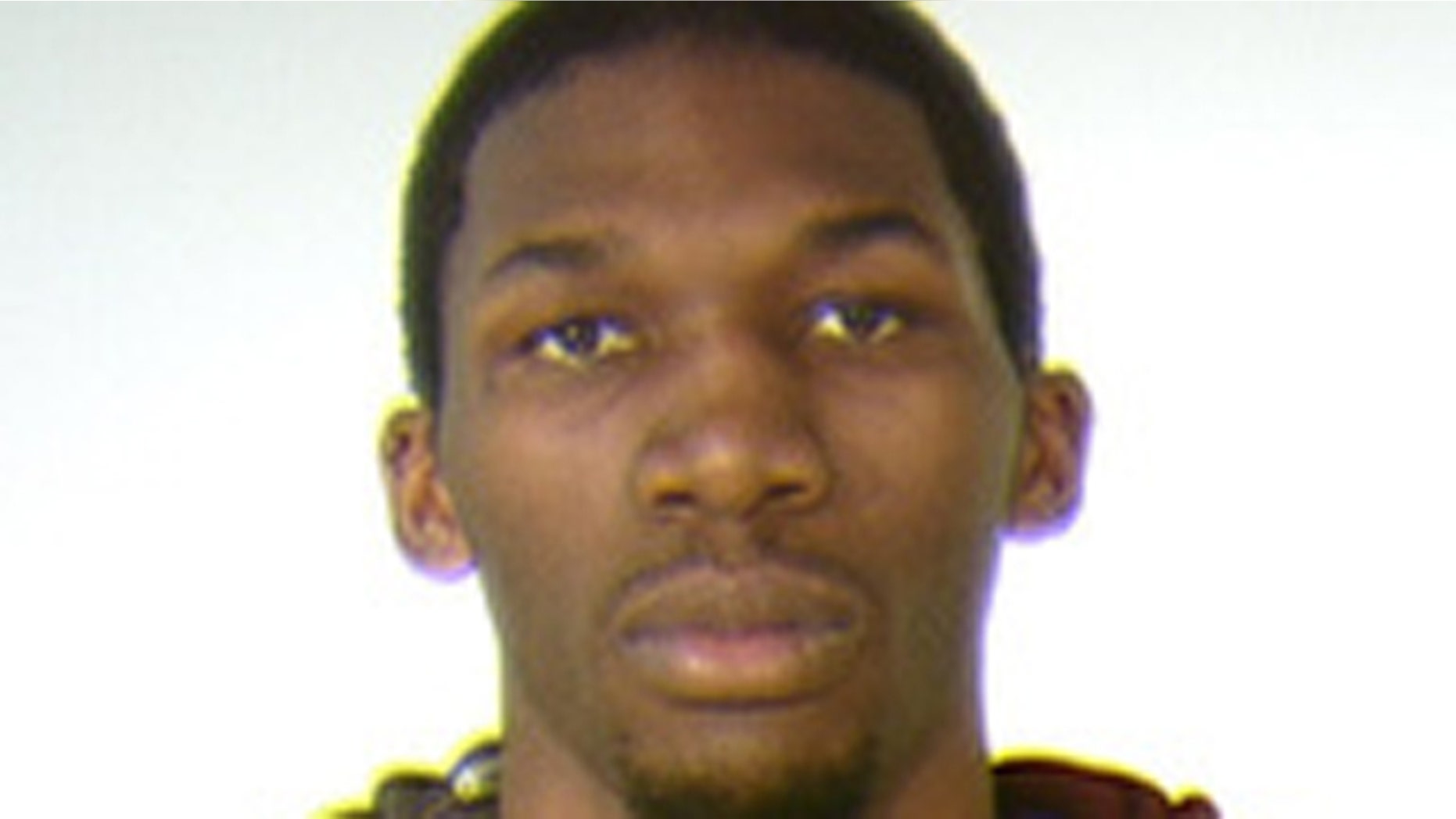 Mugshot of University of Minnesota basketball player Trevor Mbakwe.