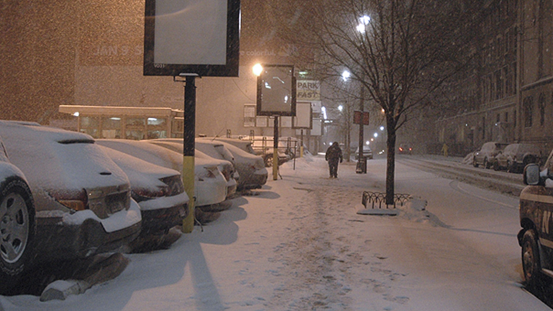 Jan. 12: A man trudges down a snow-covered sidewalk in New York.