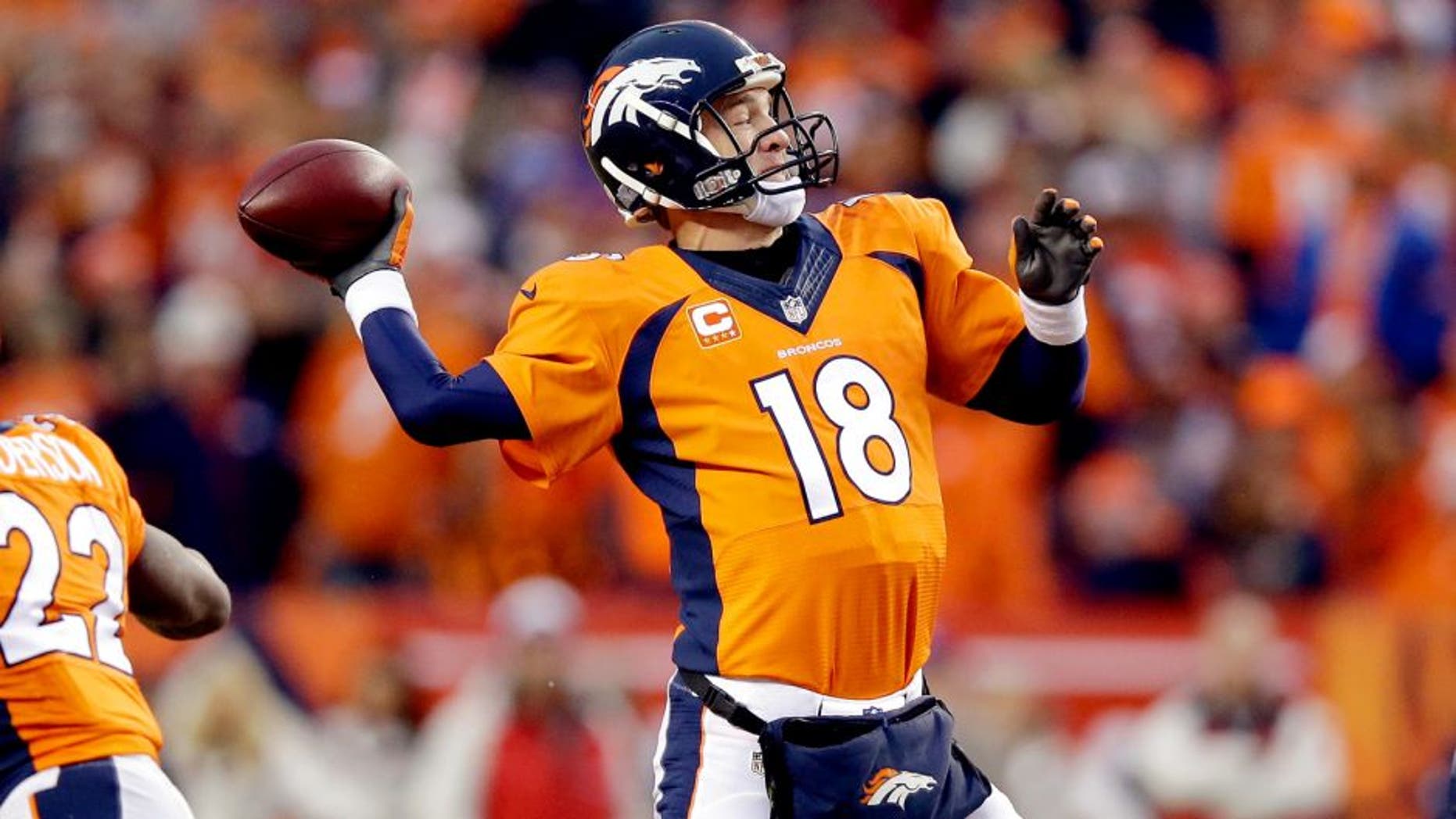 Peyton Manning #18 of the Denver Broncos passes against the Indianapolis Colts during a 2015 AFC Divisional Playoff game at Sports Authority Field at Mile High on January 11, 2015 in Denver, Colorado. (Photo by Ezra Shaw/Getty Images)