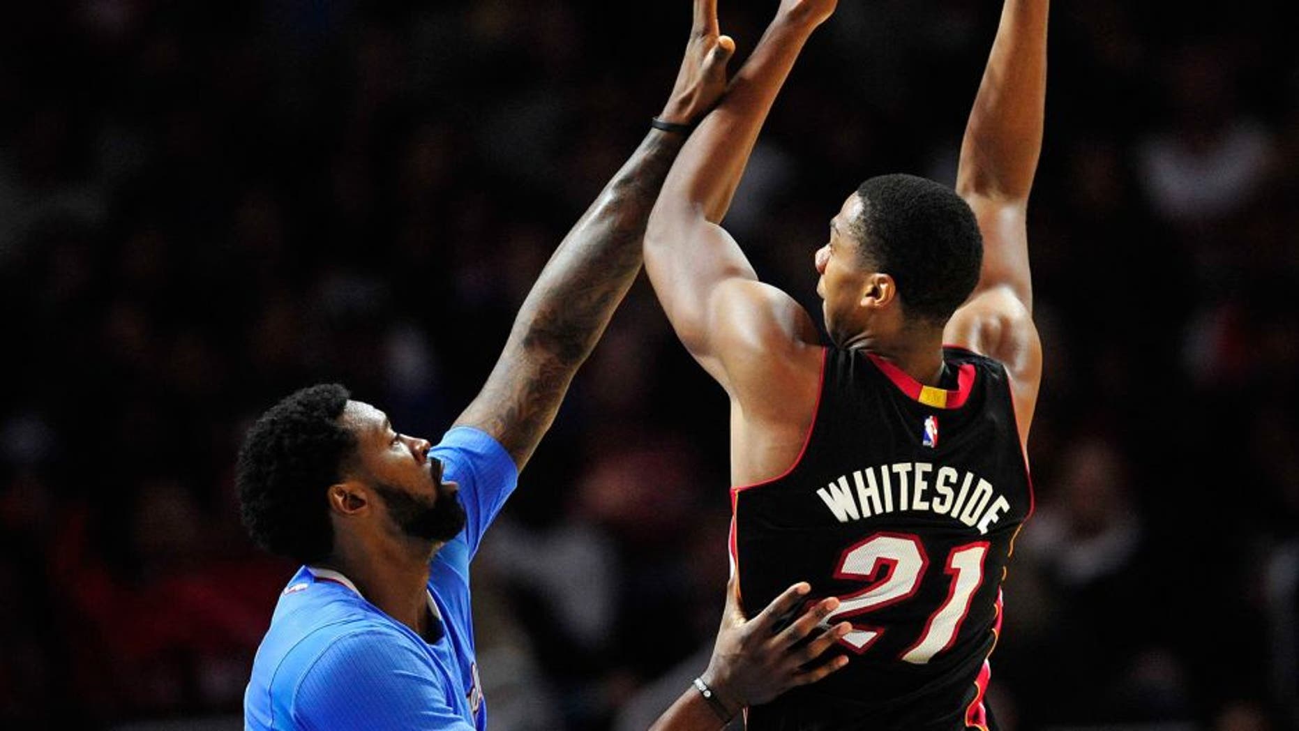 January 11, 2015; Los Angeles, CA, USA; Miami Heat center Hassan Whiteside (21) shoots against the defense of Los Angeles Clippers center DeAndre Jordan (6) during the second half at Staples Center. Mandatory Credit: Gary A. Vasquez-USA TODAY Sports