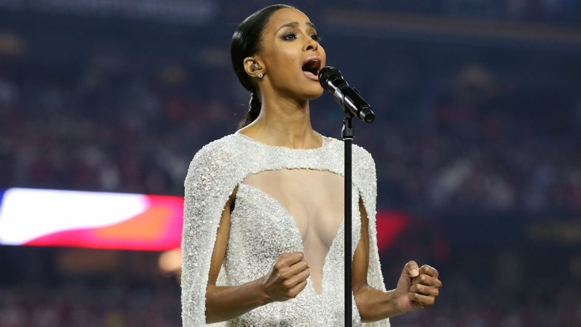 Jan 11, 2016; Glendale, AZ, USA; Recording artist Ciara sign the National Anthem prior to the game between the Alabama Crimson Tide and the Clemson Tigers in the 2016 CFP National Championship at University of Phoenix Stadium. Mandatory Credit: Matthew Emmons-USA TODAY Sports