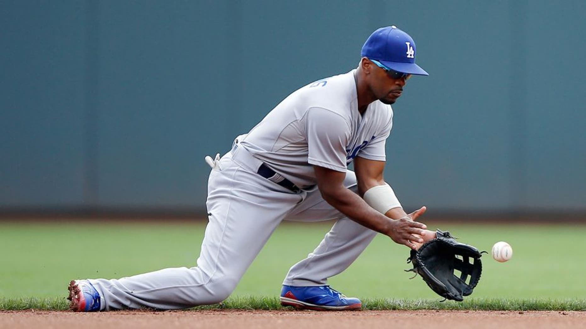 CINCINNATI, OH - AUGUST 27: Jimmy Rollins #11 of the Los Angeles Dodgers fields a ground ball against the Cincinnati Reds during a game at Great American Ball Park on August 27, 2015 in Cincinnati, Ohio. The Dodgers defeated the Reds 1-0. (Photo by Joe Robbins/Getty Images)