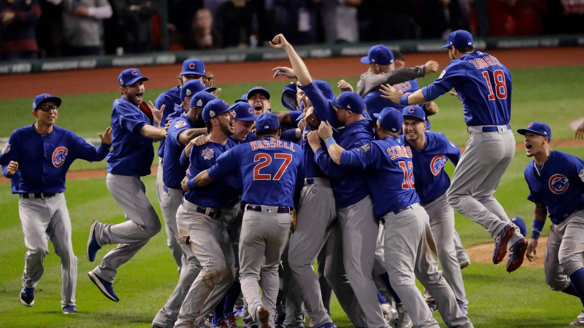 FILE - In this Nov. 3, 2016, file photo, the Chicago Cubs celebrate after Game 7 of the Major League Baseball World Series against the Cleveland Indians, in Cleveland.