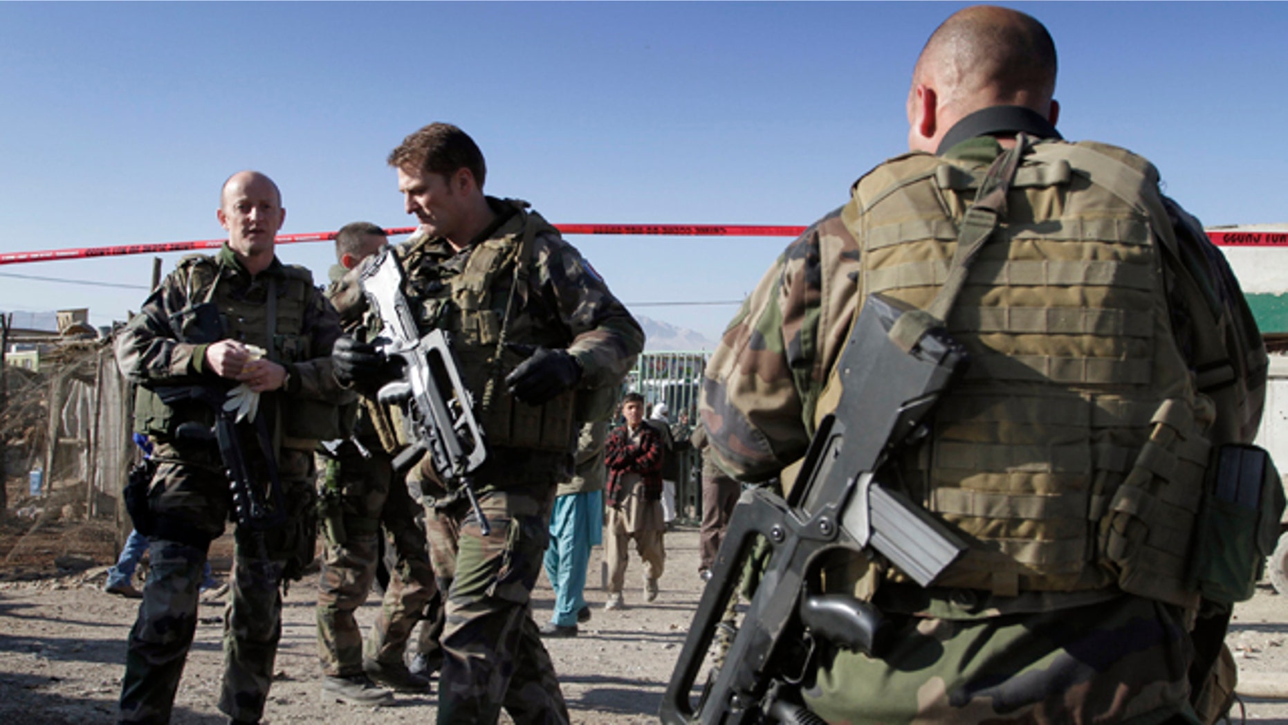 Jan. 12: French soldiers with the NATO-led International Security Assistance Force (ISAF) are seen at the scene of a suicide attack in Kabul, Afghanistan.