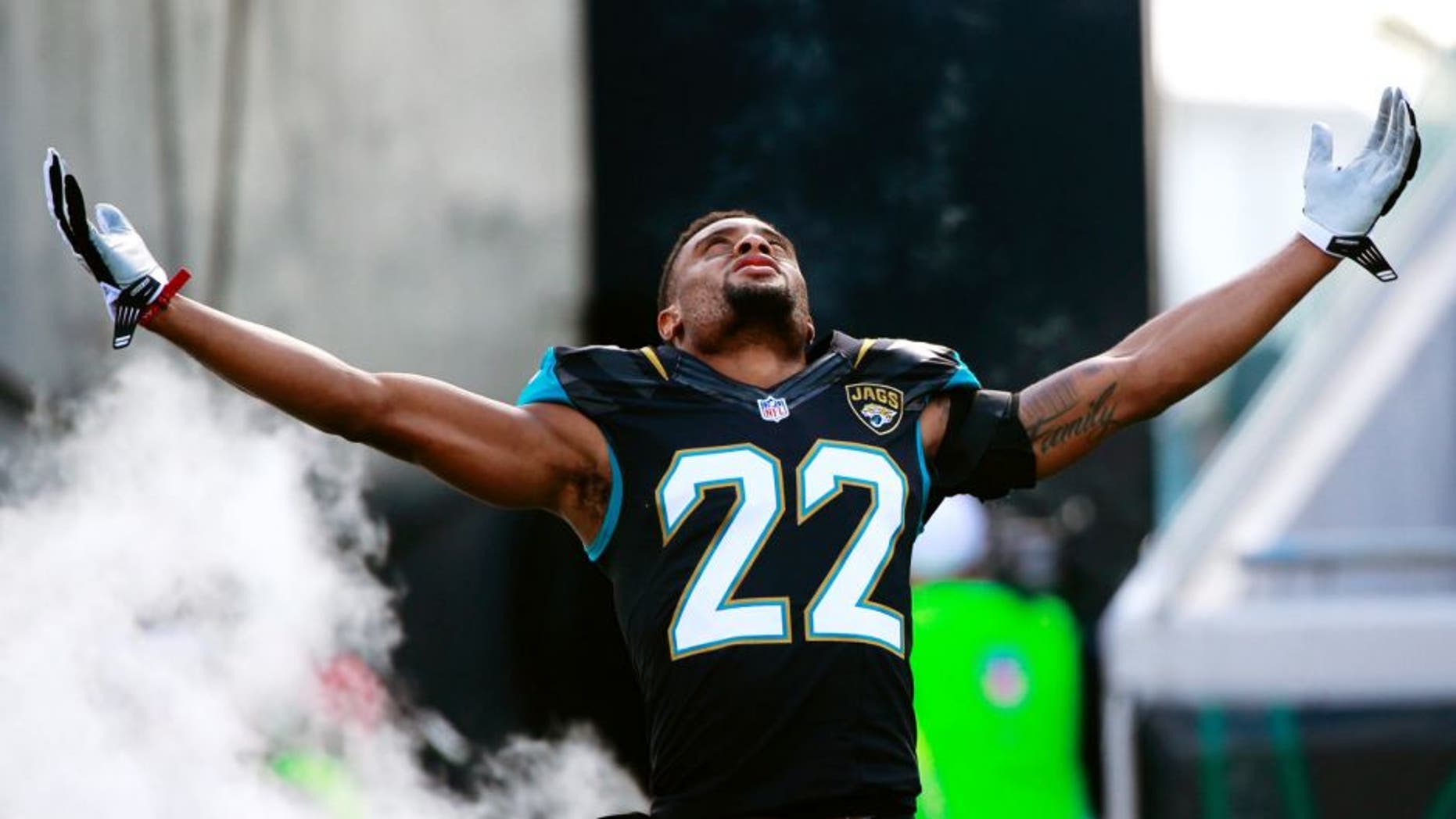 Dec 20, 2015; Jacksonville, FL, USA; Jacksonville Jaguars cornerback Aaron Colvin (22) runs out of the tunnel as he was introduced before the game Atlanta Falcons at EverBank Field. Mandatory Credit: Kim Klement-USA TODAY Sports