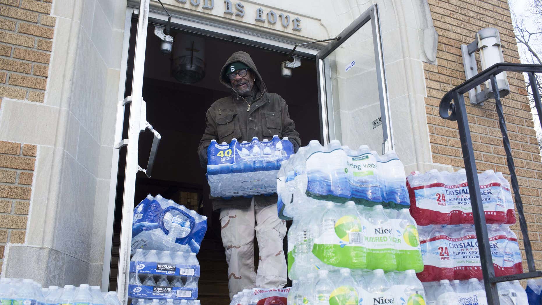Jan. 11, 2016: Maurice Rice organizes cases of water at the Joy Tabernacle Church in Flint, Mich.