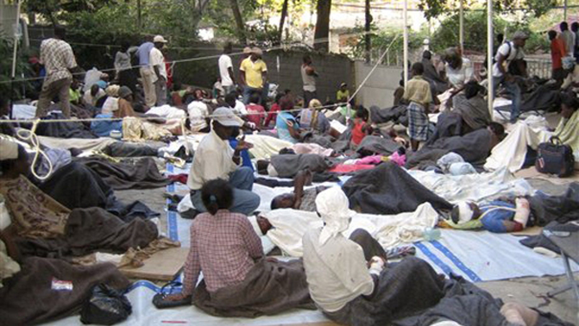 This photo provided by Medecins Sans Frontieres shows wounded people gathered at the office of Medecins Sans Frontieres in Port-au-Prince, Haiti Wednesday Jan. 13, 2010. (AP)