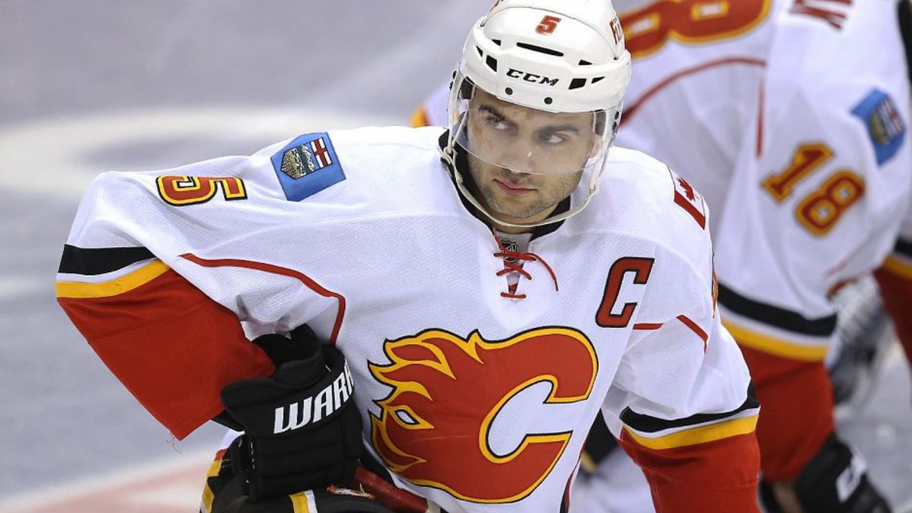 Dec 9, 2014; Toronto, Ontario, CAN; Calgary Flames defenseman Mark Giordano (5) warms up before playing against the Toronto Maple Leafs at Air Canada Centre. Mandatory Credit: Tom Szczerbowski-USA TODAY Sports