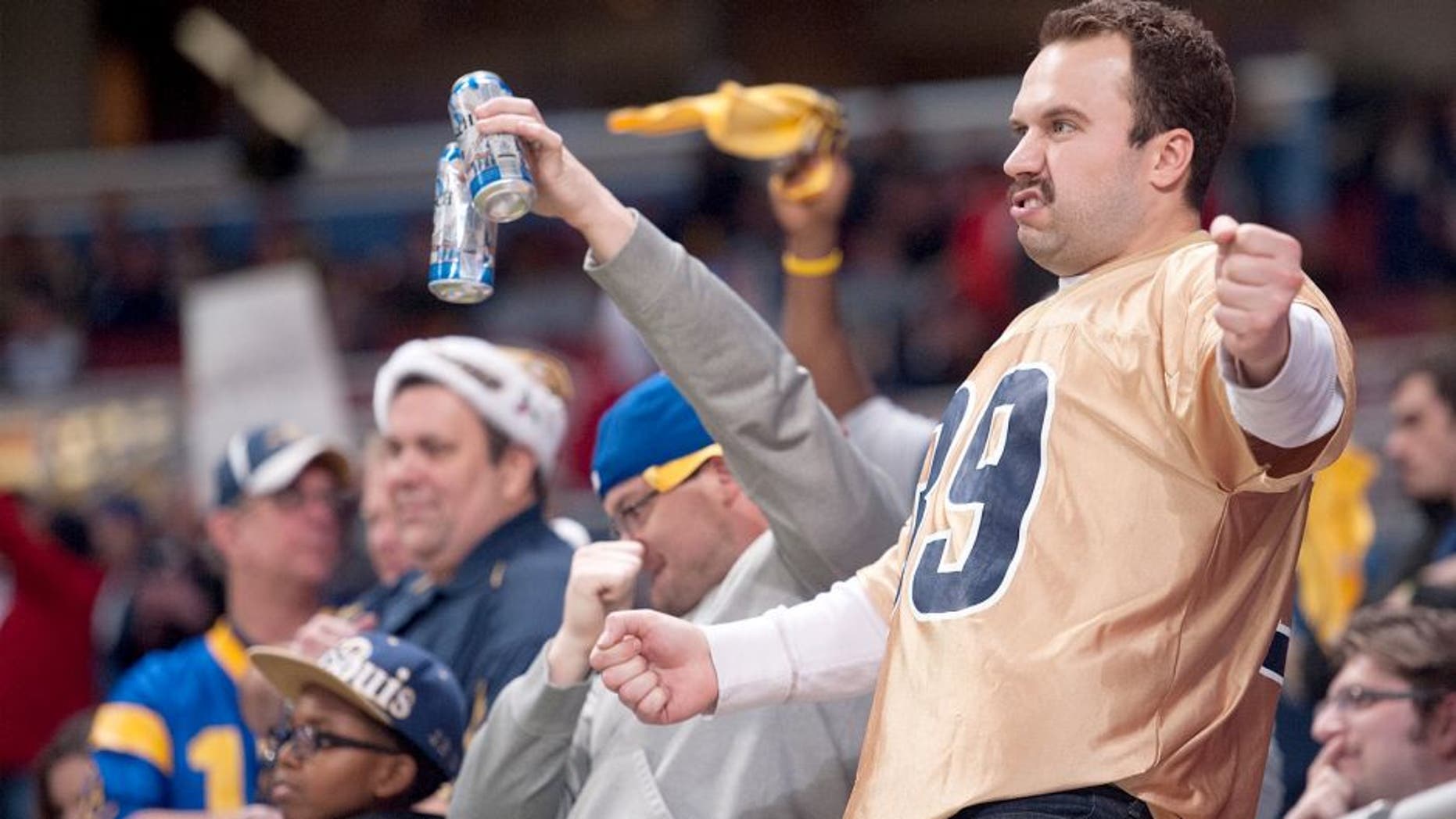 ST. LOUIS, MO - DECEMBER 17: A St. Louis Rams fans celebrates in the fourth quarter during a game against the Tampa Bay Buccaneers at the Edward Jones Dome on December 17, 2015 in St. Louis, Missouri. (Photo by Michael B. Thomas/Getty Images)