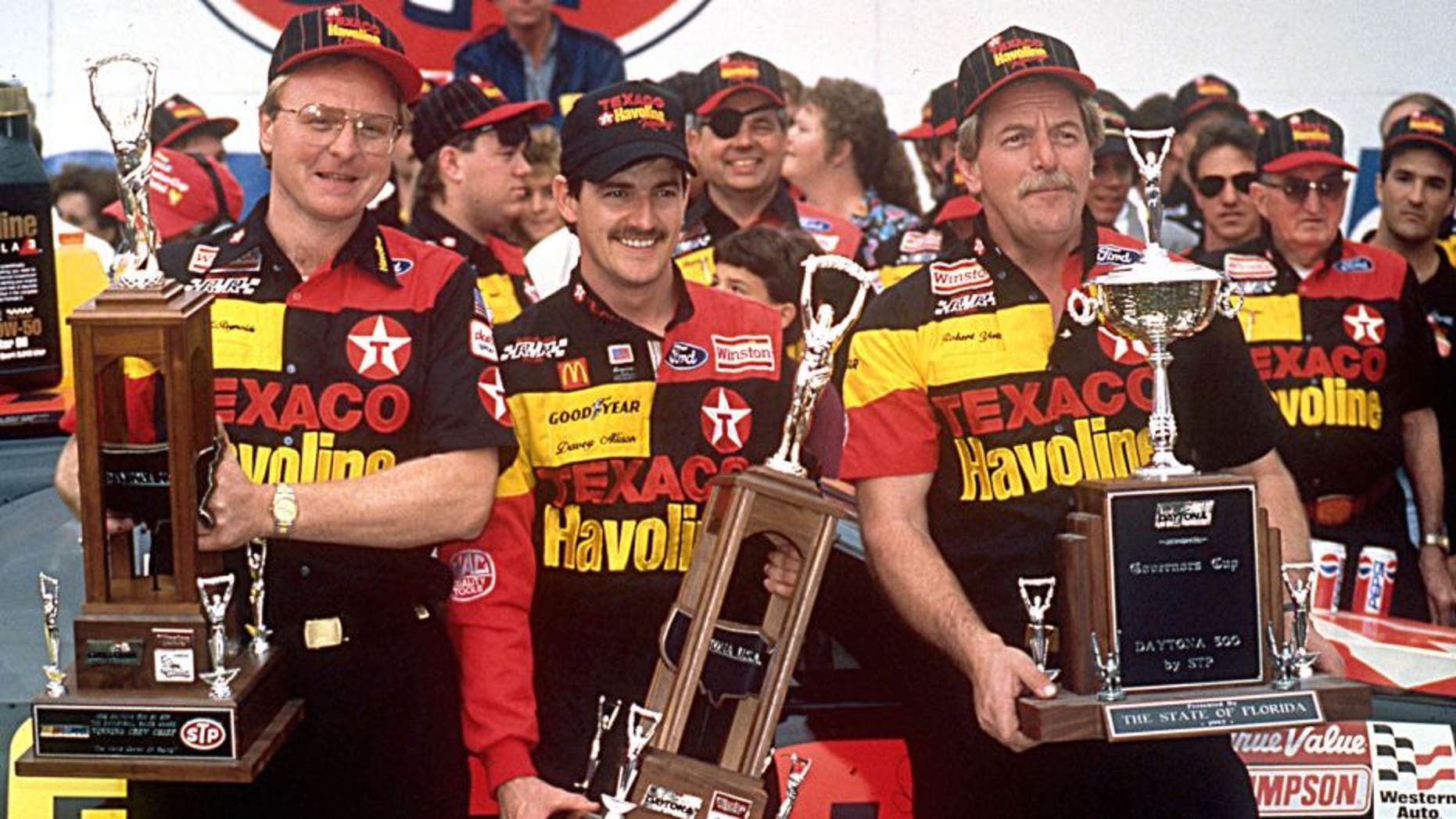 DAYTONA BEACH, FL ? February 16, 1992: Davey Allison (C) celebrates in victory lane at Daytona International Speedway with crew chief Larry McReynolds (L) and car owner Robert Yates (R) after winning the Daytona 500 NASCAR Cup race. (Photo by ISC Images & Archives via Getty Images)