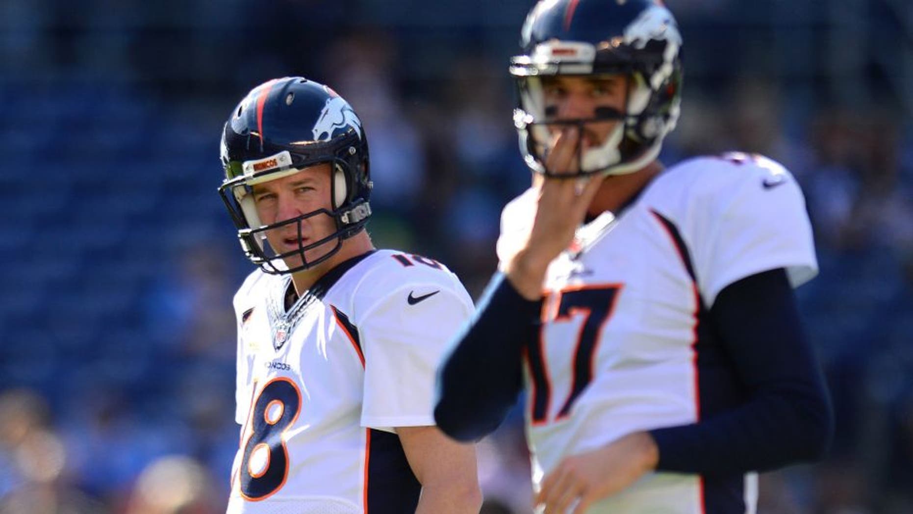 Dec 14, 2014; San Diego, CA, USA; Denver Broncos quarterback Peyton Manning (18) and quarterback Brock Osweiler (17) before the game against the San Diego Chargers at Qualcomm Stadium. Mandatory Credit: Jake Roth-USA TODAY Sports