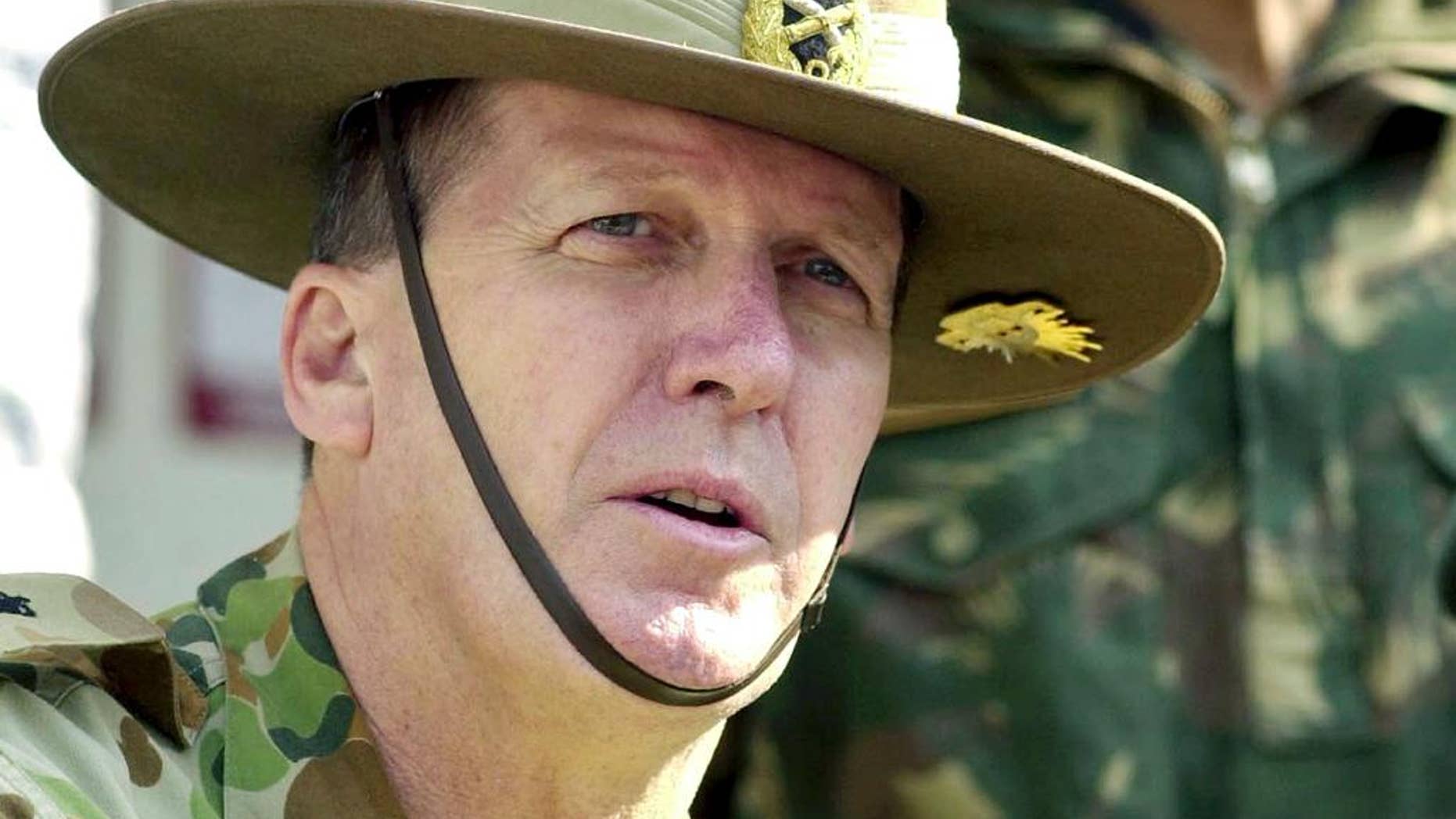 FILE - In this Nov. 23, 2004, file photo, Australian Army Chief Lt. Gen. Peter Leahy speaks at a press conference in Srinagar, India. Now former Australian army chief Leahy on Thursday, July 7, 2016, warned Australia against "blindly going along with" the United States after the Chilcot inquiry was critical of Britain's involvement in the Iraq war. (AP Photo/Mukhtar Khan, File)
