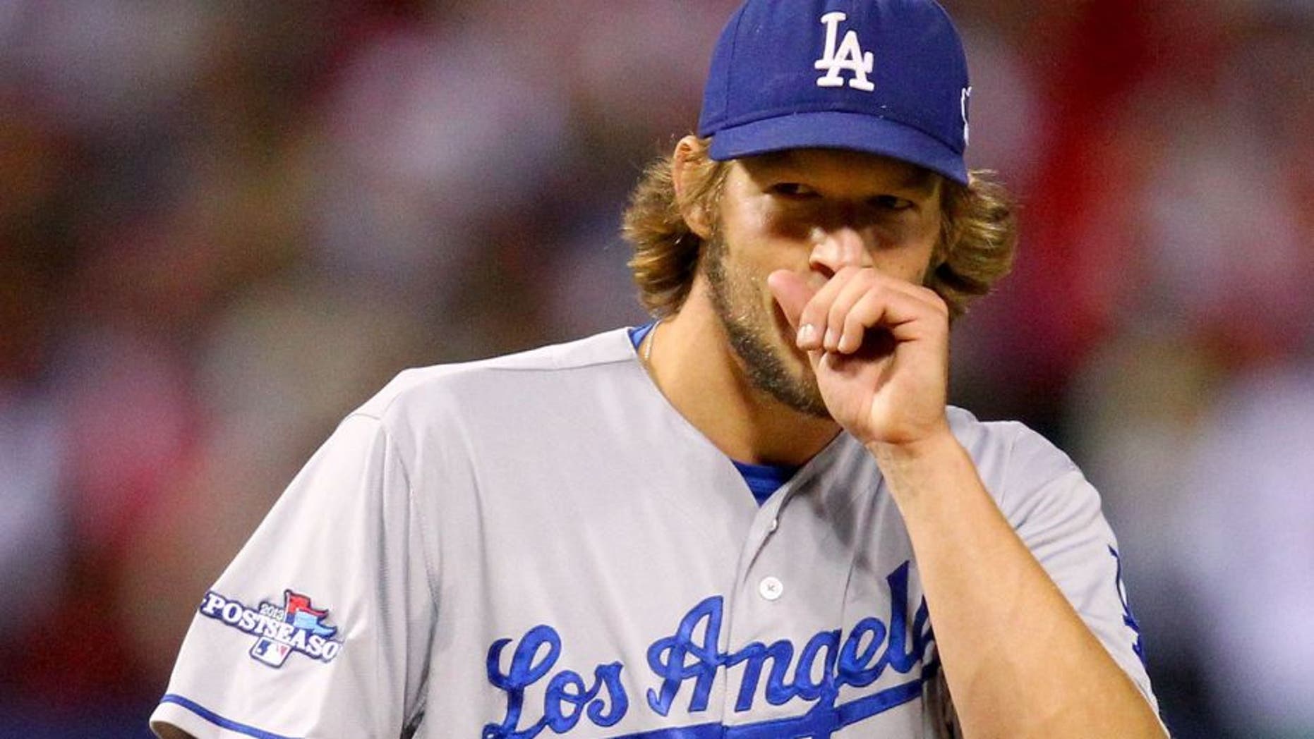 ST LOUIS, MO - OCTOBER 18: Pitcher Clayton Kershaw #22 of the Los Angeles Dodgers reacts while on the mound in the third inning against the St. Louis Cardinals in Game Six of the National League Championship Series at Busch Stadium on October 18, 2013 in St Louis, Missouri. (Photo by Dilip Vishwanat/Getty Images)