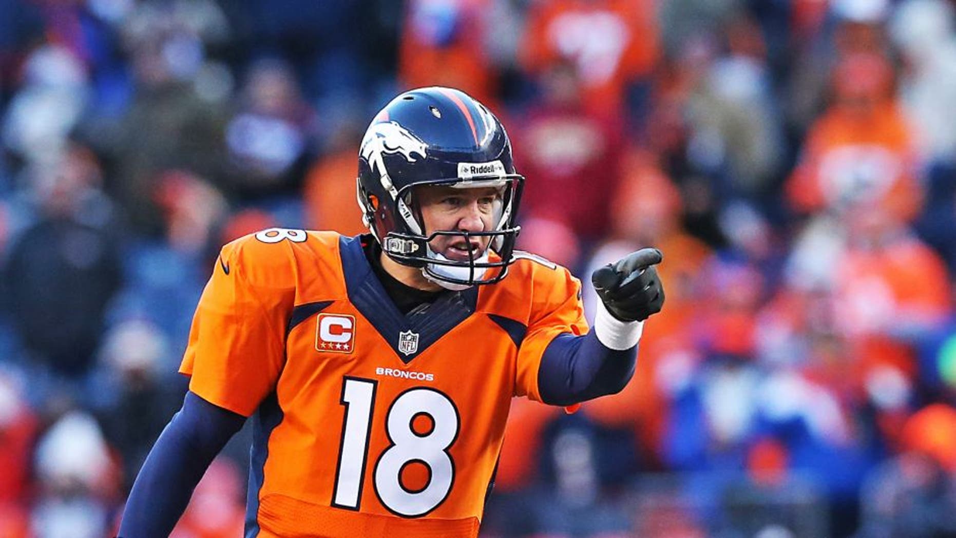 Jan 12, 2014; Denver, CO, USA; Denver Broncos quarterback Peyton Manning (18) points and signals prior to the snap against the San Diego Chargers during the 2013 AFC divisional playoff football game at Sports Authority Field at Mile High. Mandatory Credit: Matthew Emmons-USA TODAY Sports