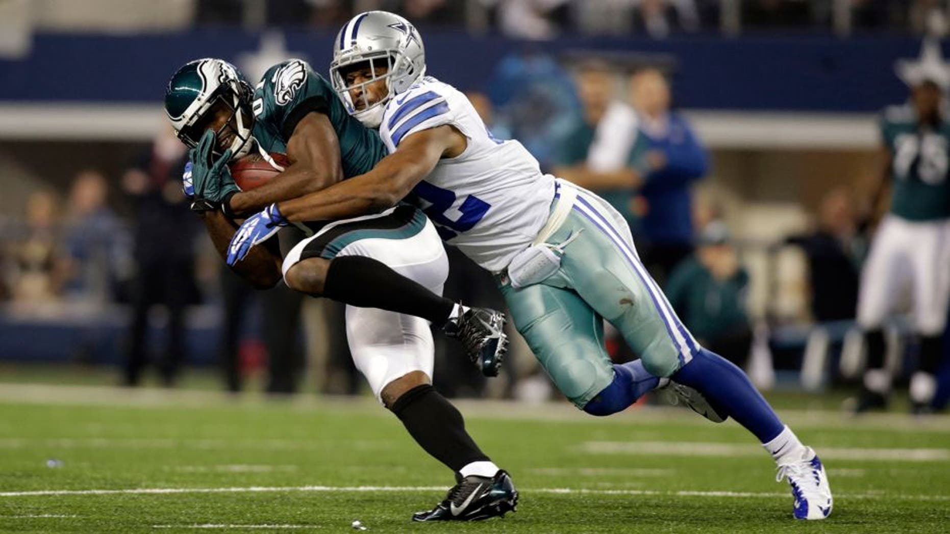 Dec 29, 2013; Arlington, TX, USA; Philadelphia Eagles wide receiver Jason Avant (81) is tackled by Dallas Cowboys free safety Barry Church (42) in the second quarter at AT&T Stadium. Mandatory Credit: Tim Heitman-USA TODAY Sports