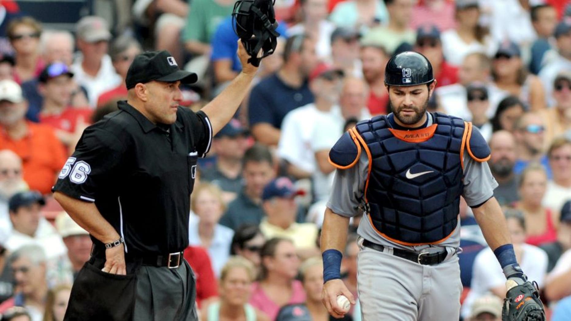 BOSTON, MA - SEPTEMBER 2: Alex Avila #13 of the Detroit Tigers calls for timeout from homeplate umpire Eric Cooper #56 in the seventh inning against the Boston Red Sox at Fenway Park on September 2, 2013 in Boston, Massachusetts. The Tigers won 3-0. (Photo by Darren McCollester/Getty Images)