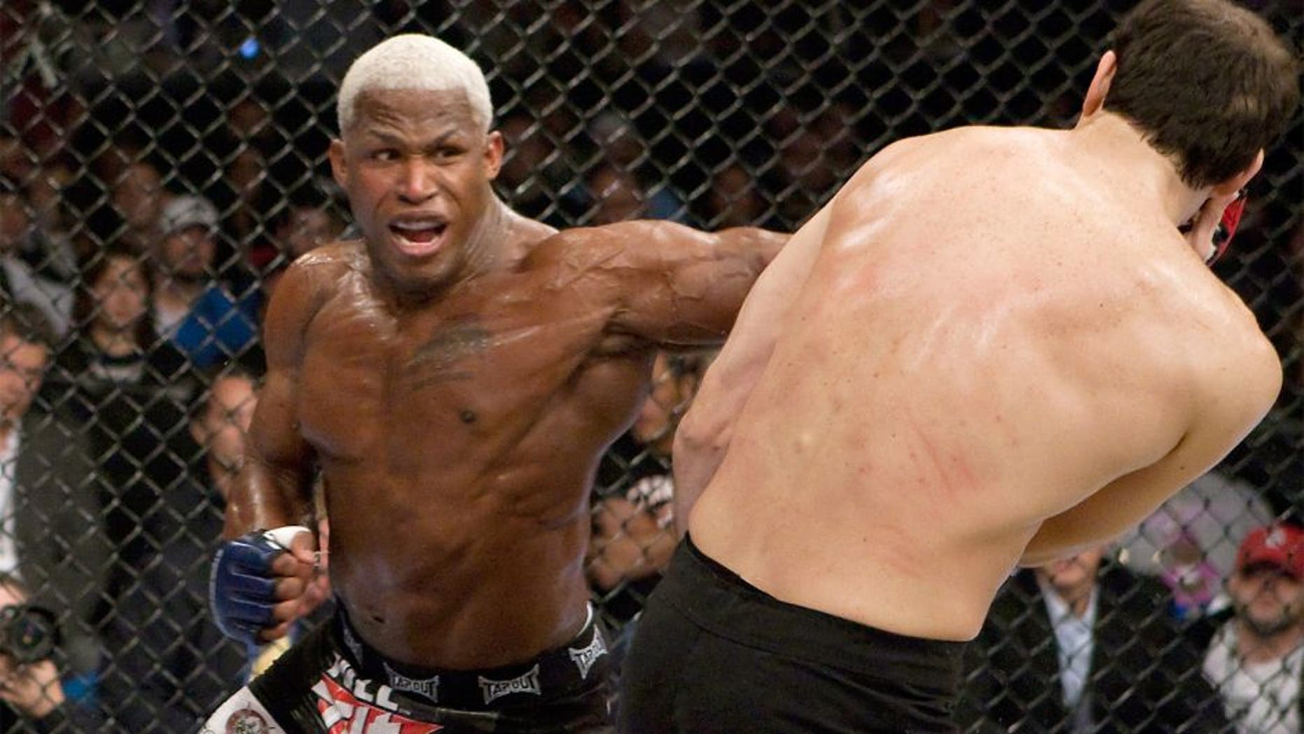 ST. LOUIS - MAY 15: (L-R) Kevin Randleman punches Roger Gracie during their bout at the Strikeforce: Heavy Artillery event at the Scottrade Center on May 15, 2010 in St. Louis, Missouri. (Photo by Esther Lin/Forza LLC via Getty Images)