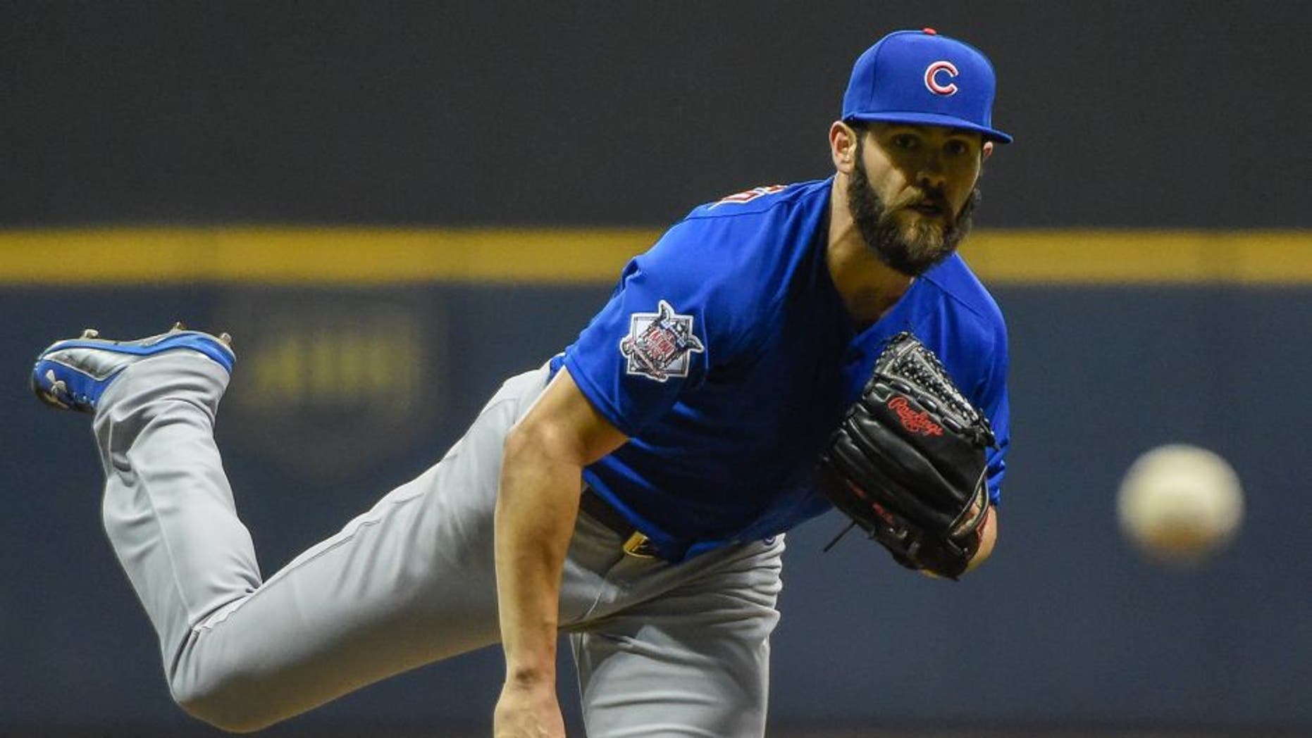 Oct 2, 2015; Milwaukee, WI, USA; Chicago Cubs pitcher Jake Arrieta (49) pitches in the first inning against the Milwaukee Brewers at Miller Park. Mandatory Credit: Benny Sieu-USA TODAY Sports