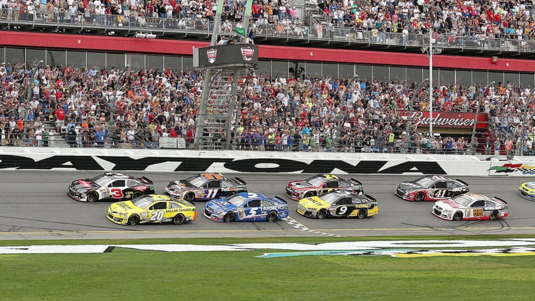 Austin Dillon (3) leads Matt Kenseth (20), Kasey Kahne (5), Denny Hamlin (11), Marcus Ambrose (9), Jeff Gordon (24), and Kurt Busch (41) to the start of the Daytona 500 at Daytona International Speedway in Daytona Beach, Fla., on Sunday, Feb. 23, 2014. (Stephen M. Dowell/Orlando Sentinel/MCT)