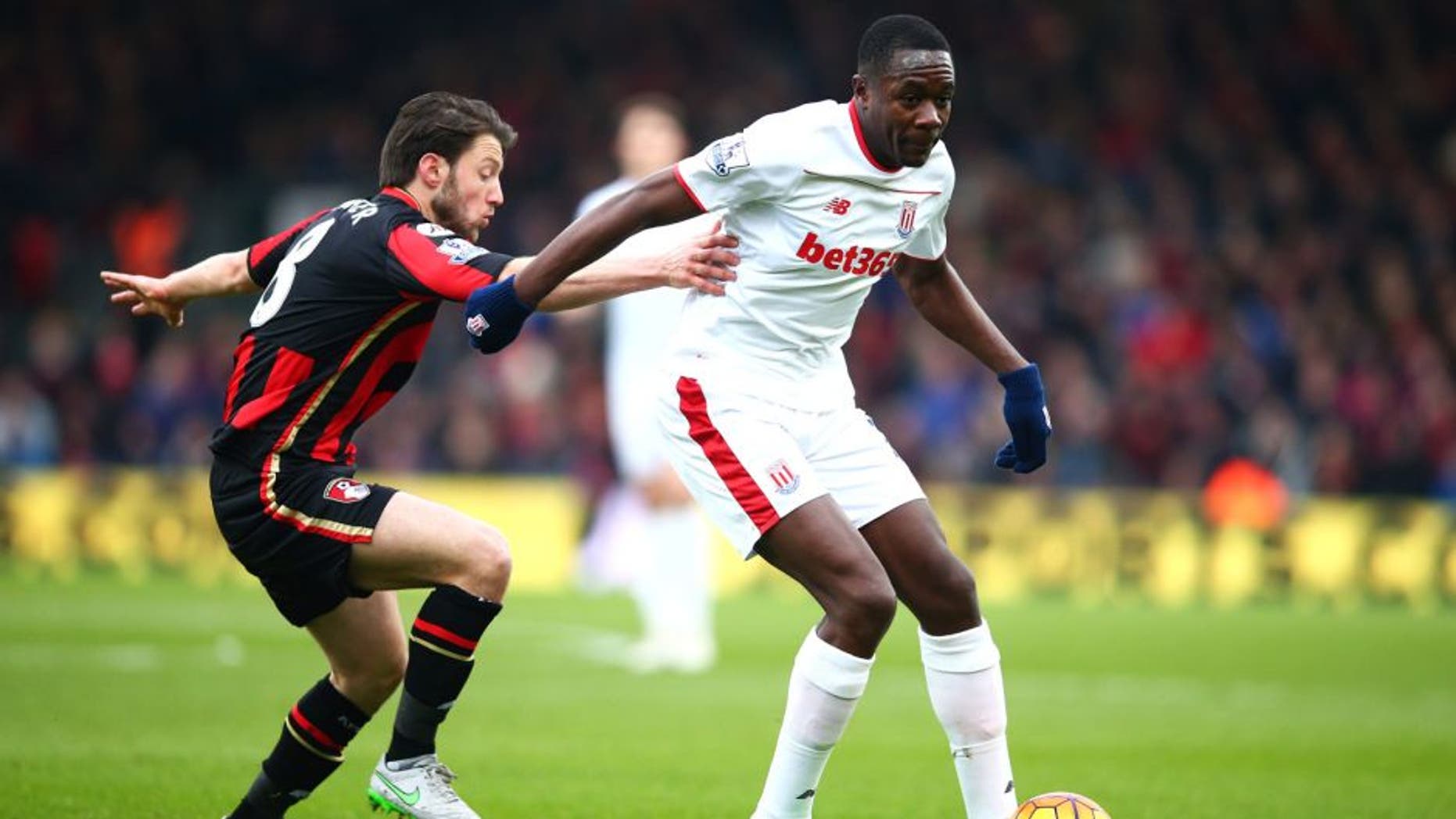BOURNEMOUTH, ENGLAND - FEBRUARY 13: Giannelli Imbula of Stoke City controls the ball under pressure of Harry Arter of Bournemouth during the Barclays Premier League match between A.F.C. Bournemouth and Stoke City at Vitality Stadium on February 13, 2016 in Bournemouth, England. (Photo by Paul Gilham/Getty Images)